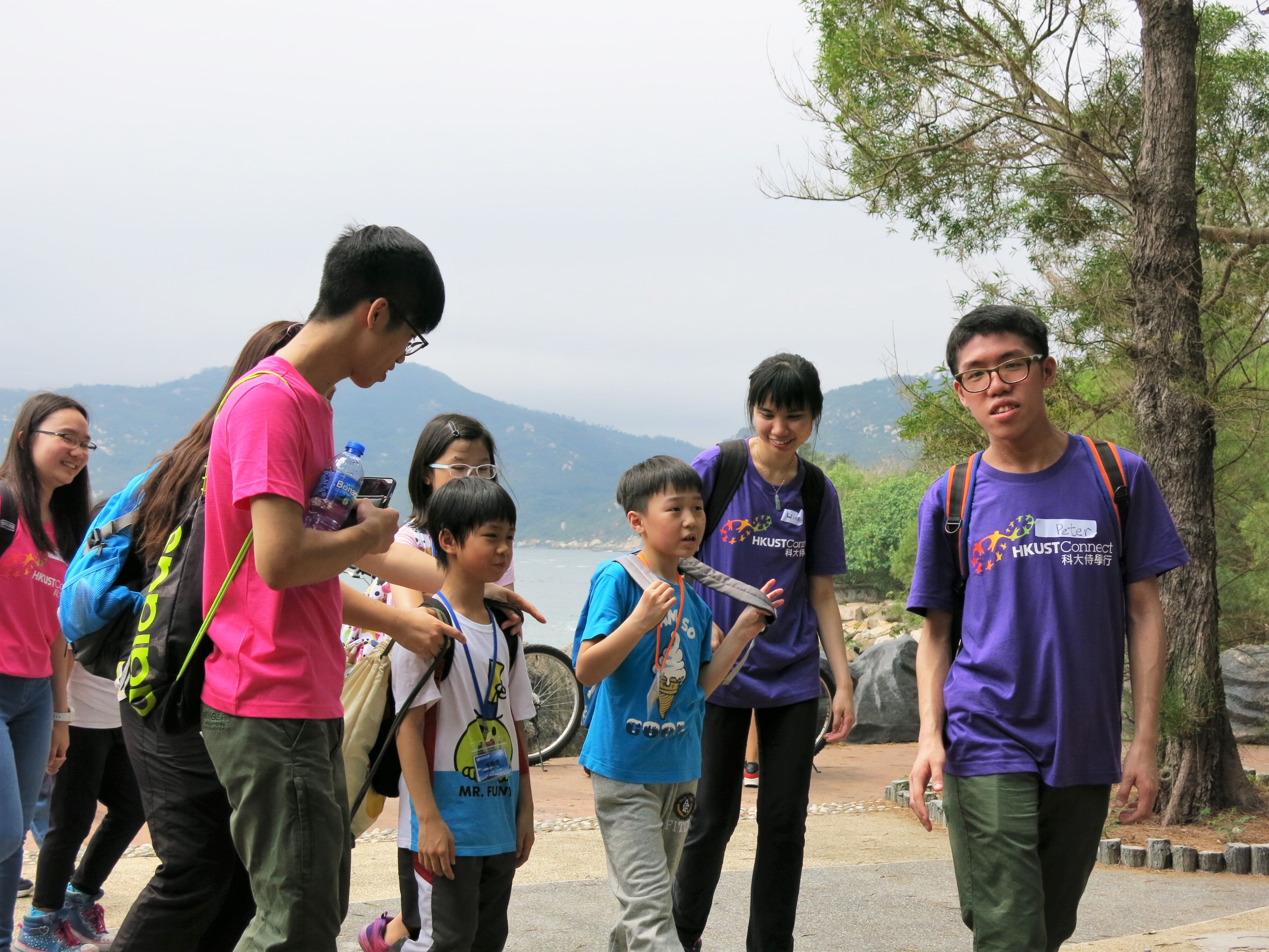 Volunteers travelling around Cheung Chau with the children
