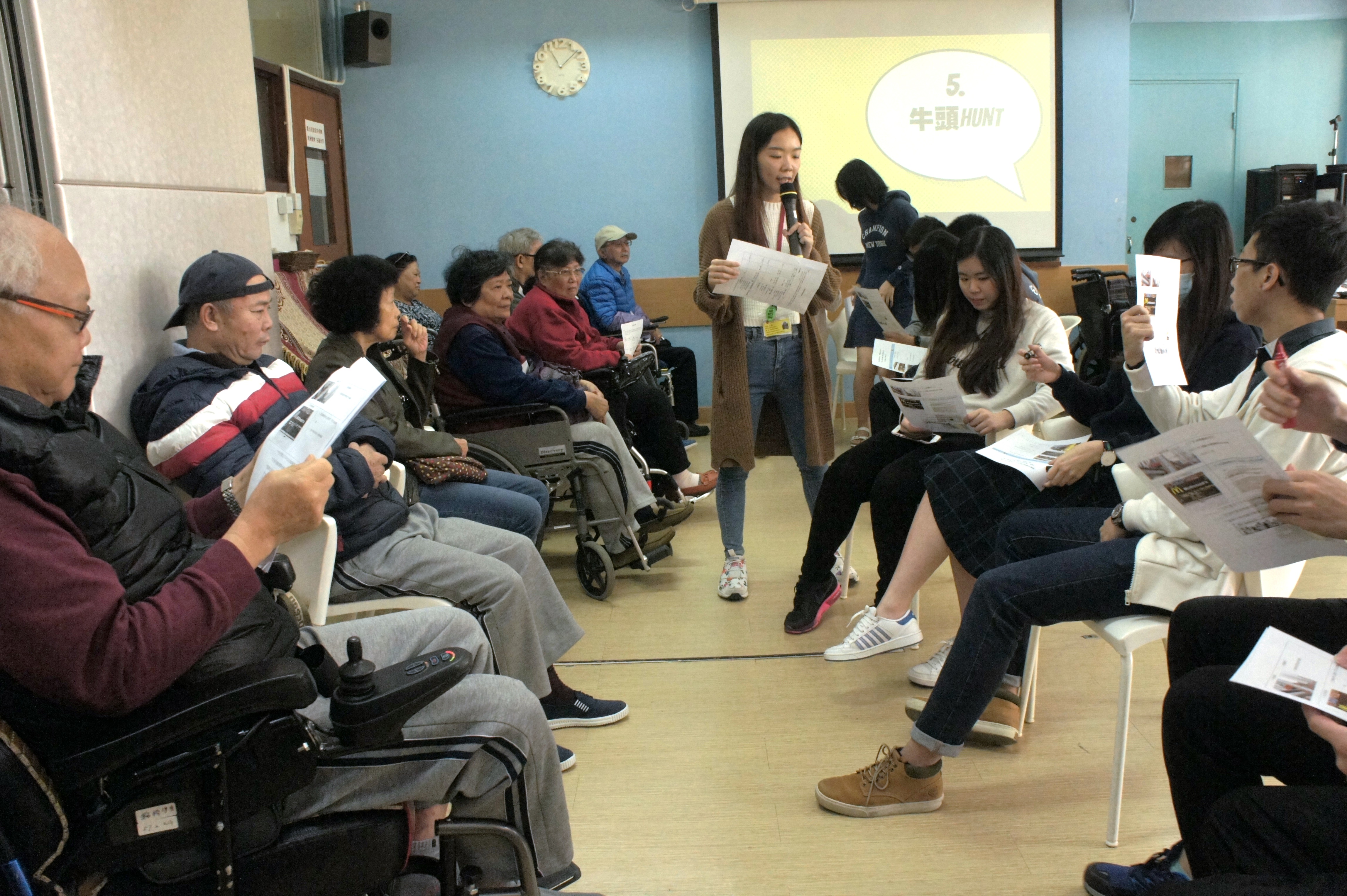Volunteers and wheelchair users getting to know each other