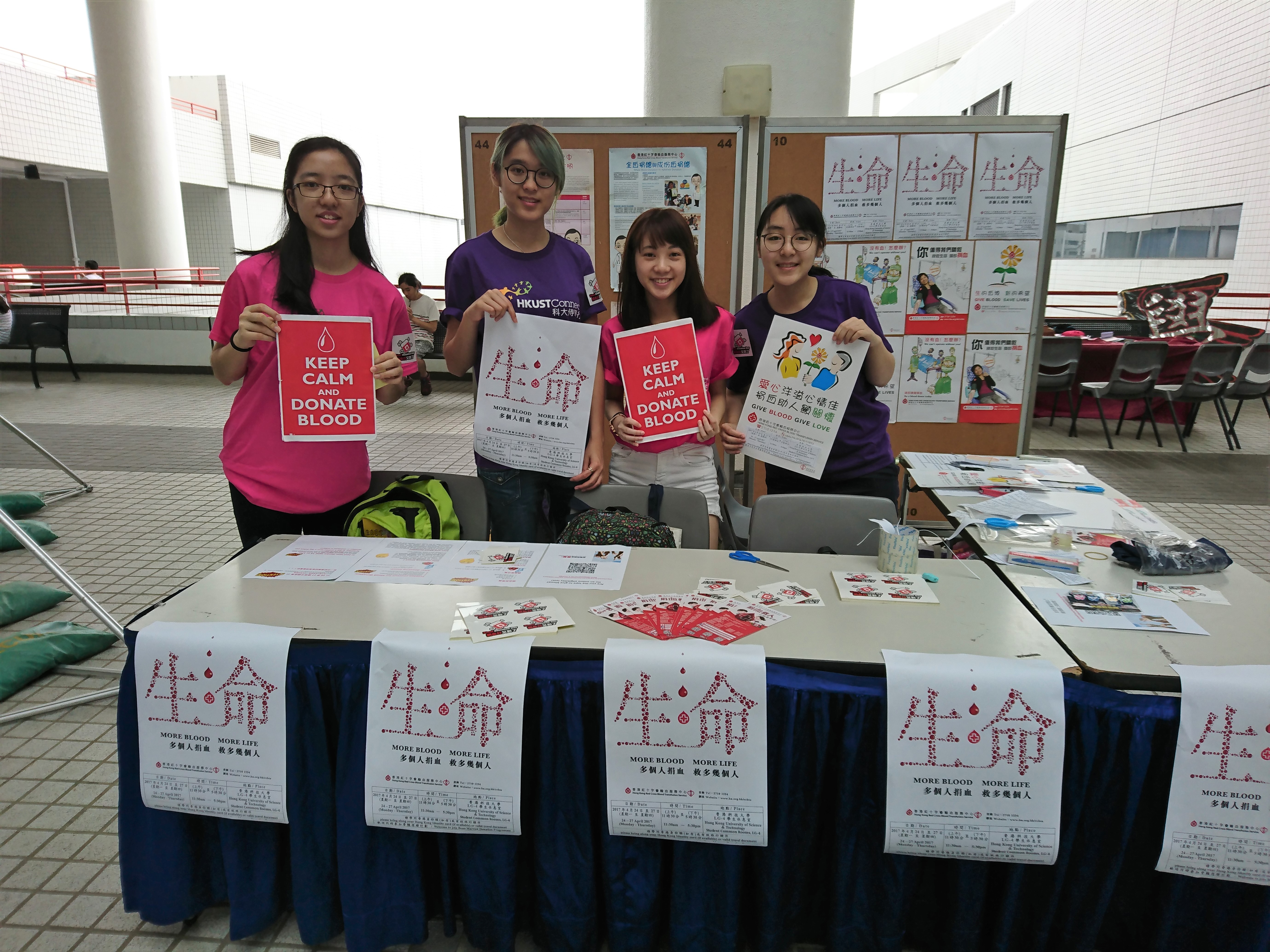 Volunteers promoting the event at the information booth