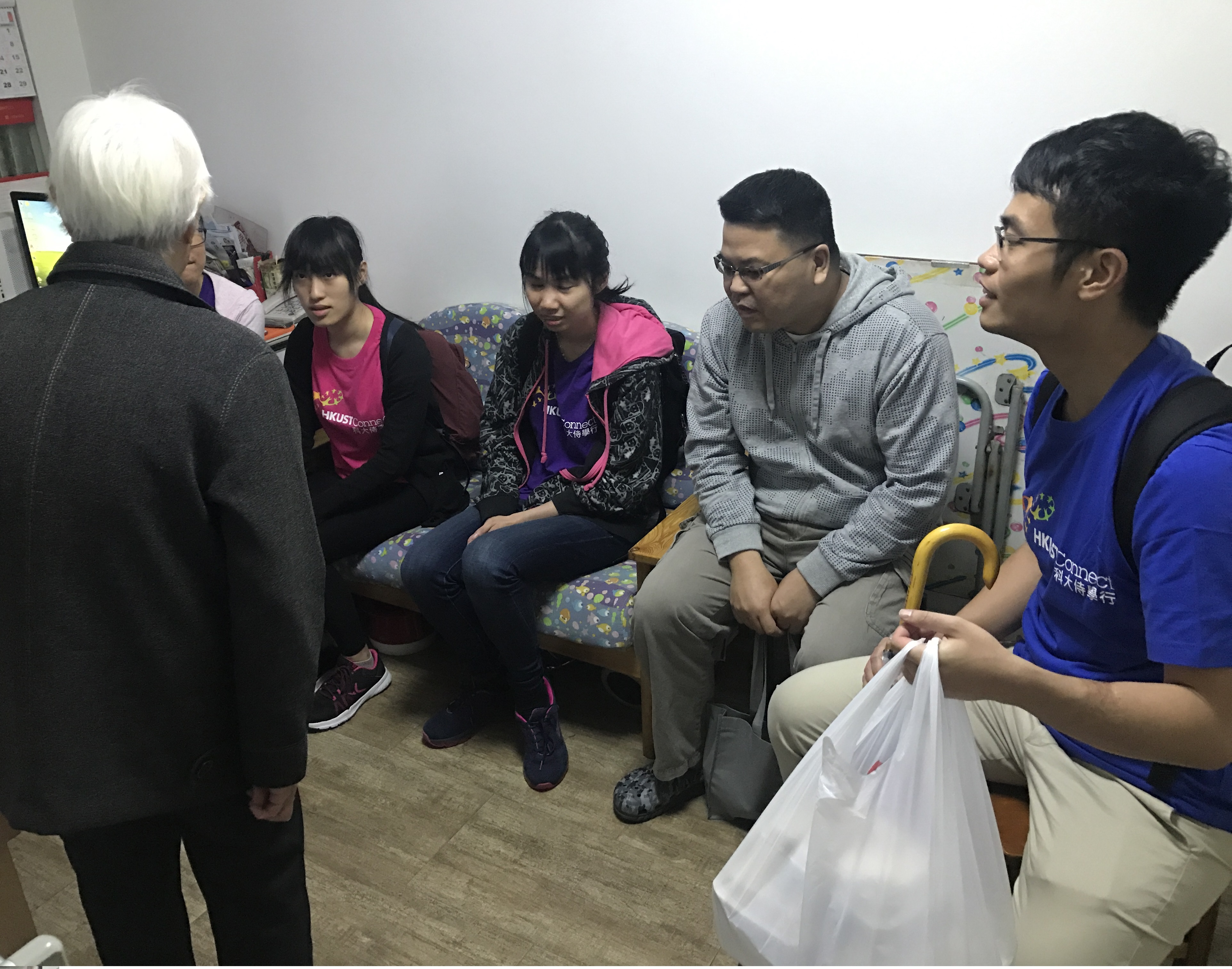 Volunteers chatting with elders