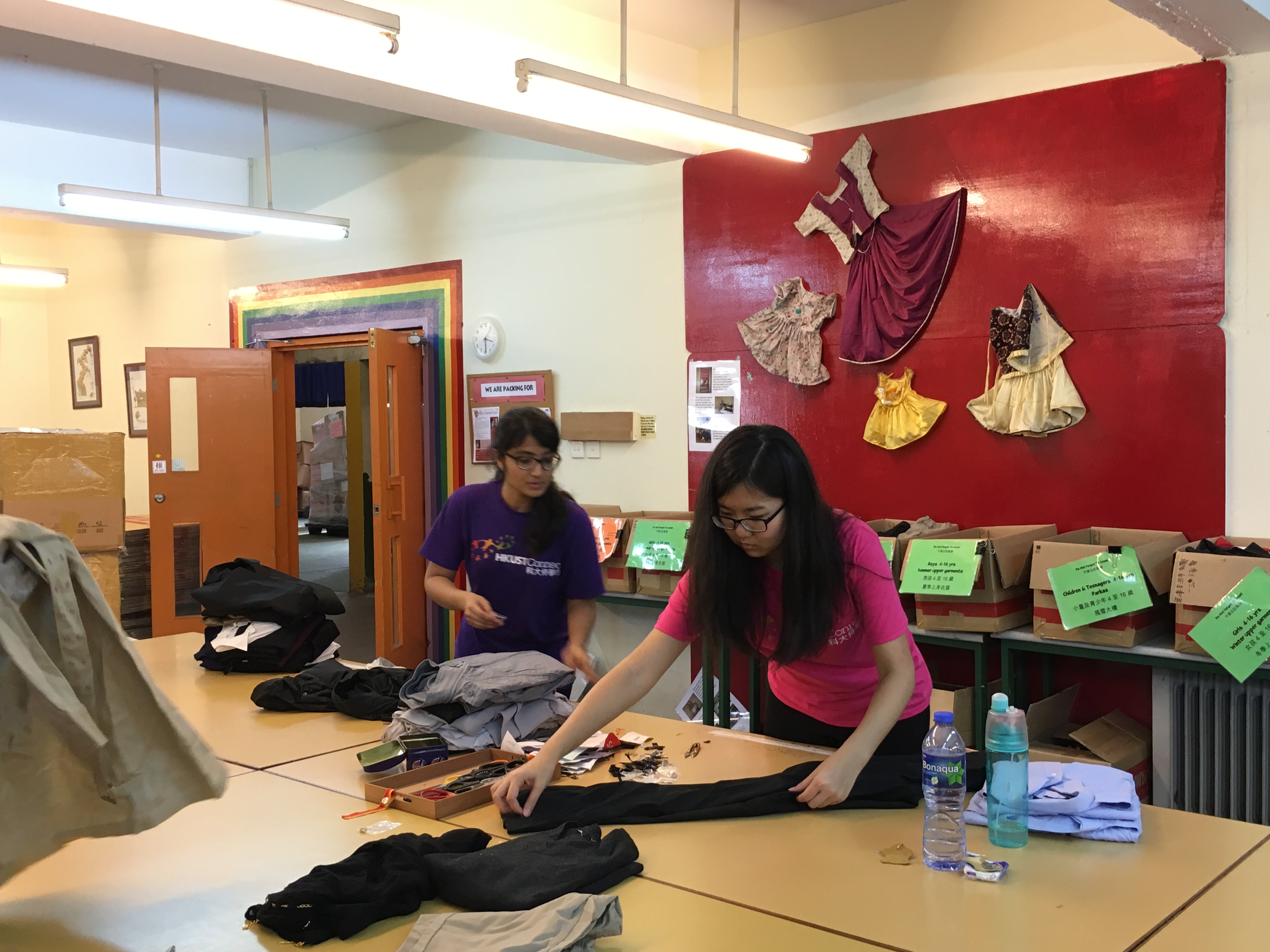 Tidying up and packing donated clothes