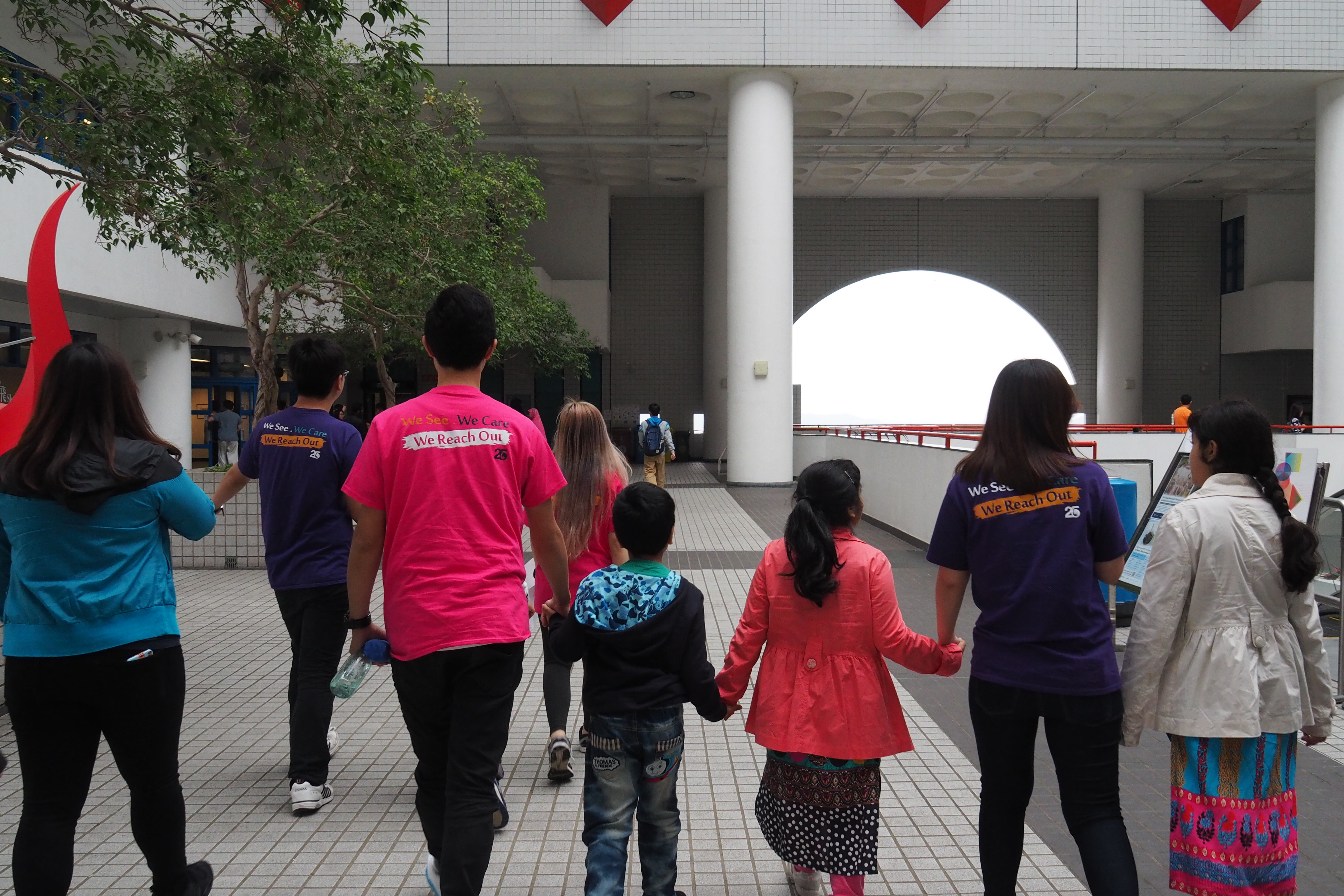 Volunteers leading a HKUST Campus tour to recipients