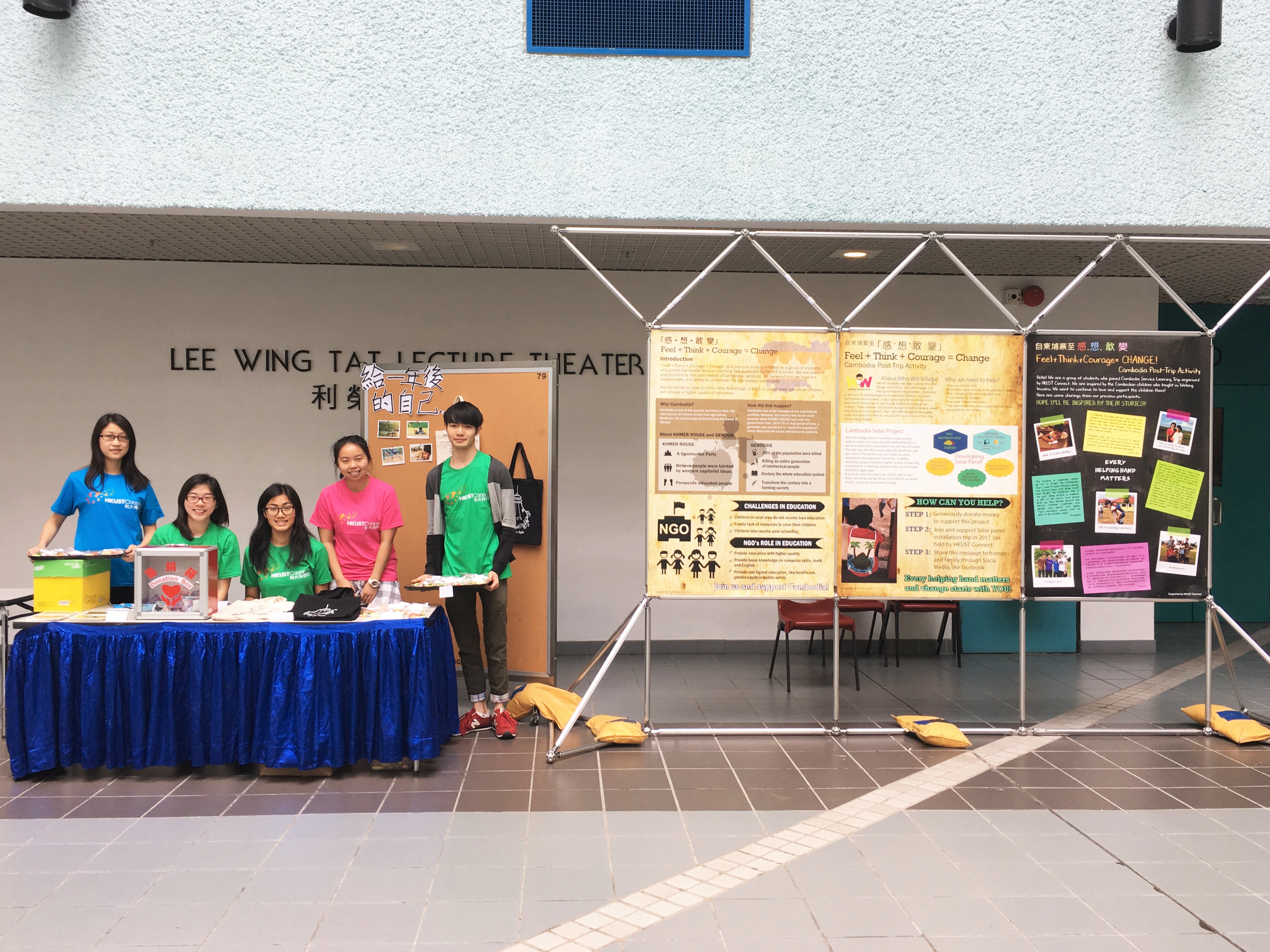 Volunteers setting up an exhibition for fund-raising