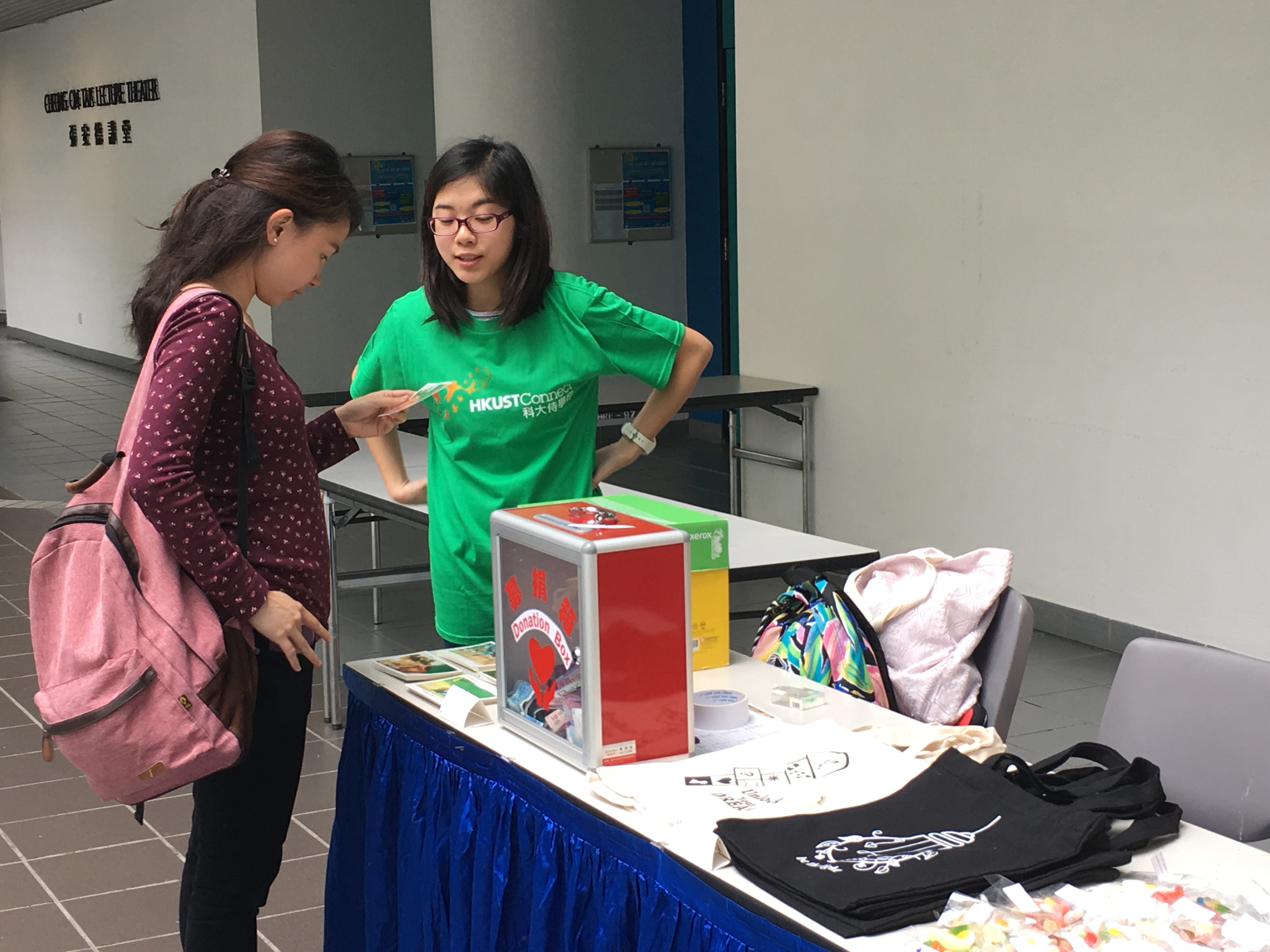 Promoting postcards and tote bags that volunteers design by themselves