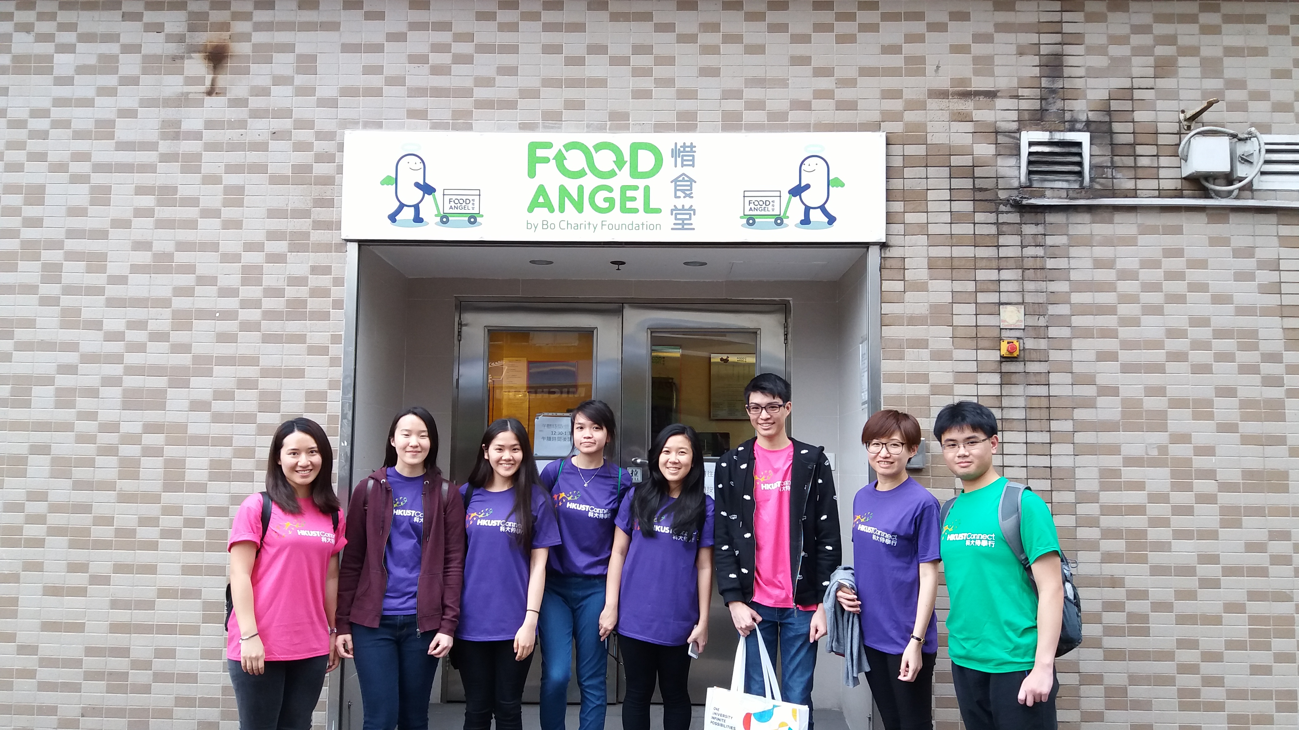 Taking a group photo at Food Angel Community Kitchen