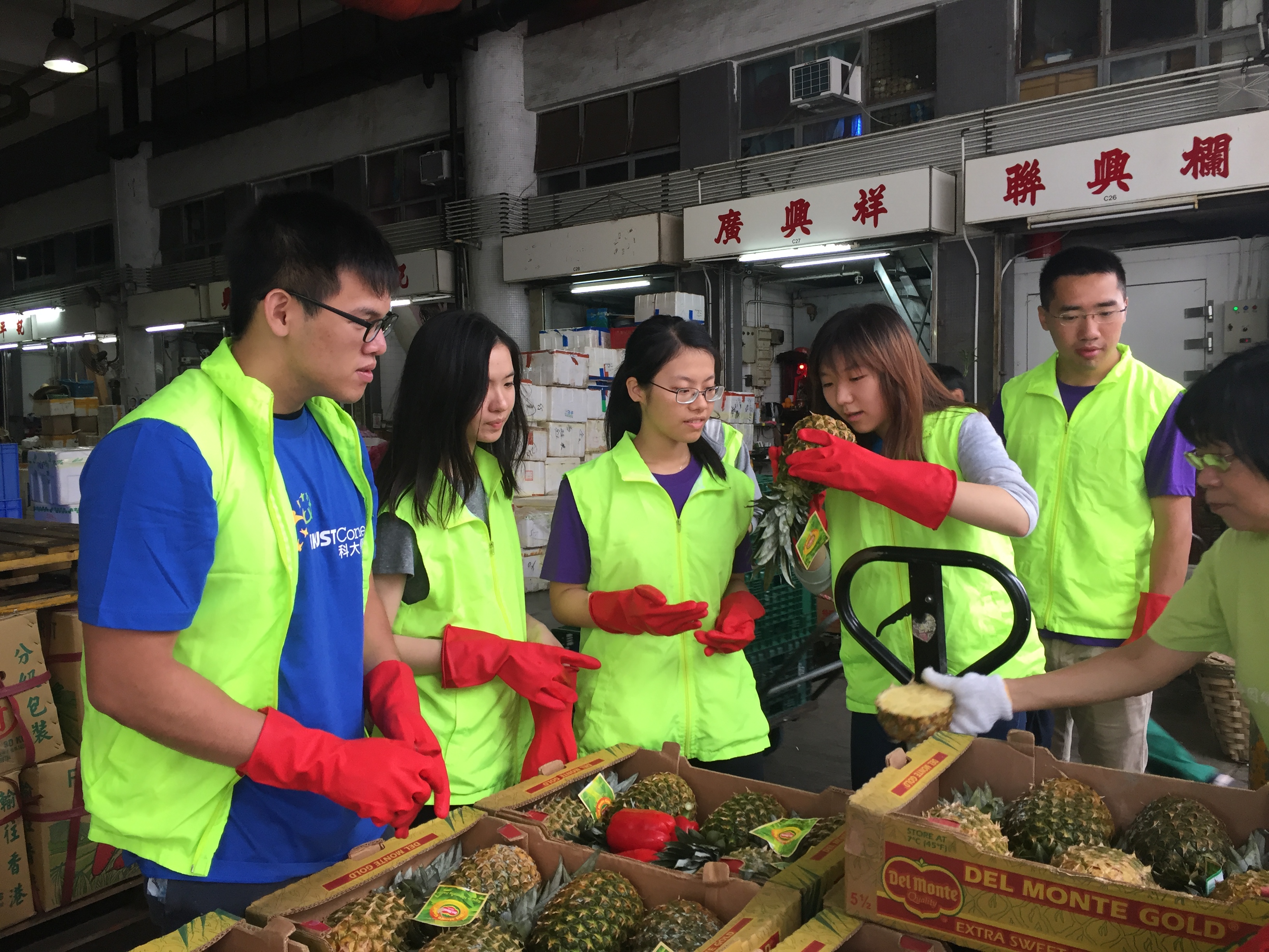 Volunteers checking if the pineapples are good to donate to people in need