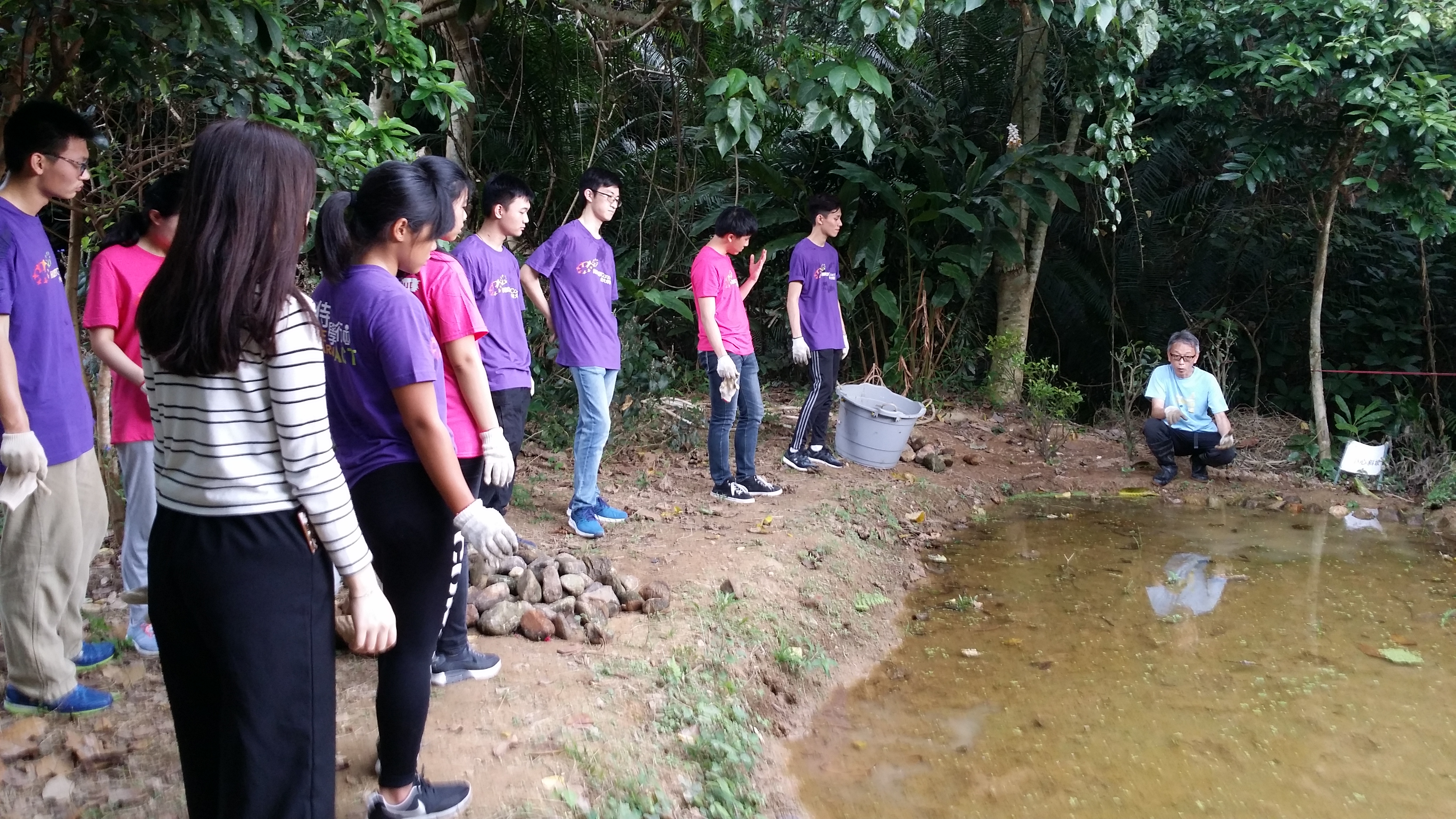 Staff of the Reserve explaining the biological features of a pond