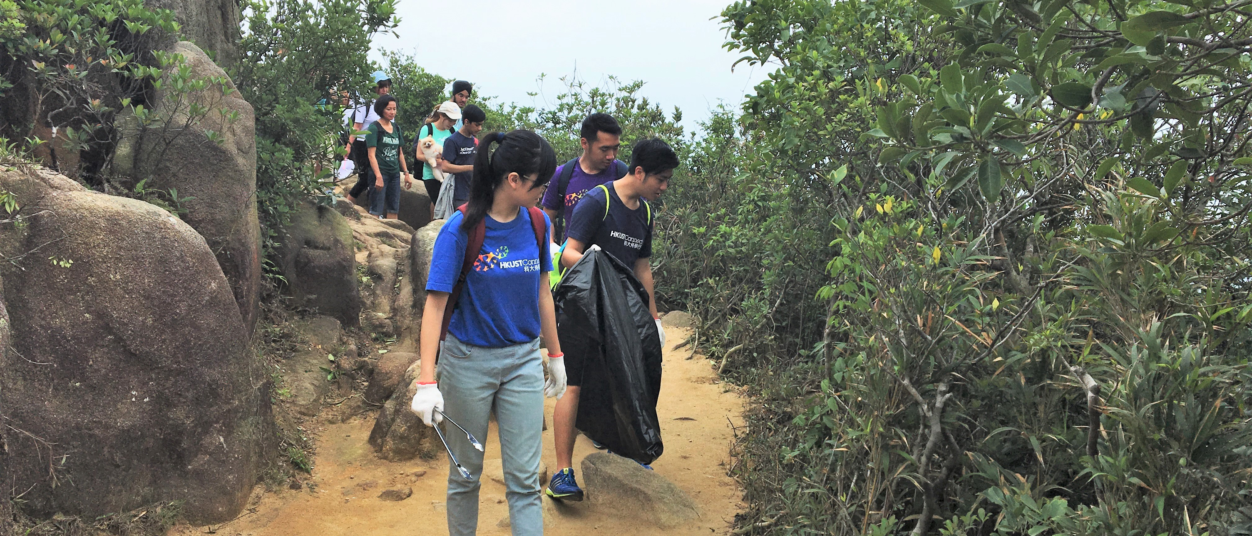 Picking up litter along the hiking track