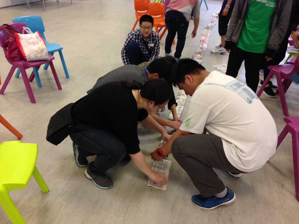 Building their paper tanks in the competition