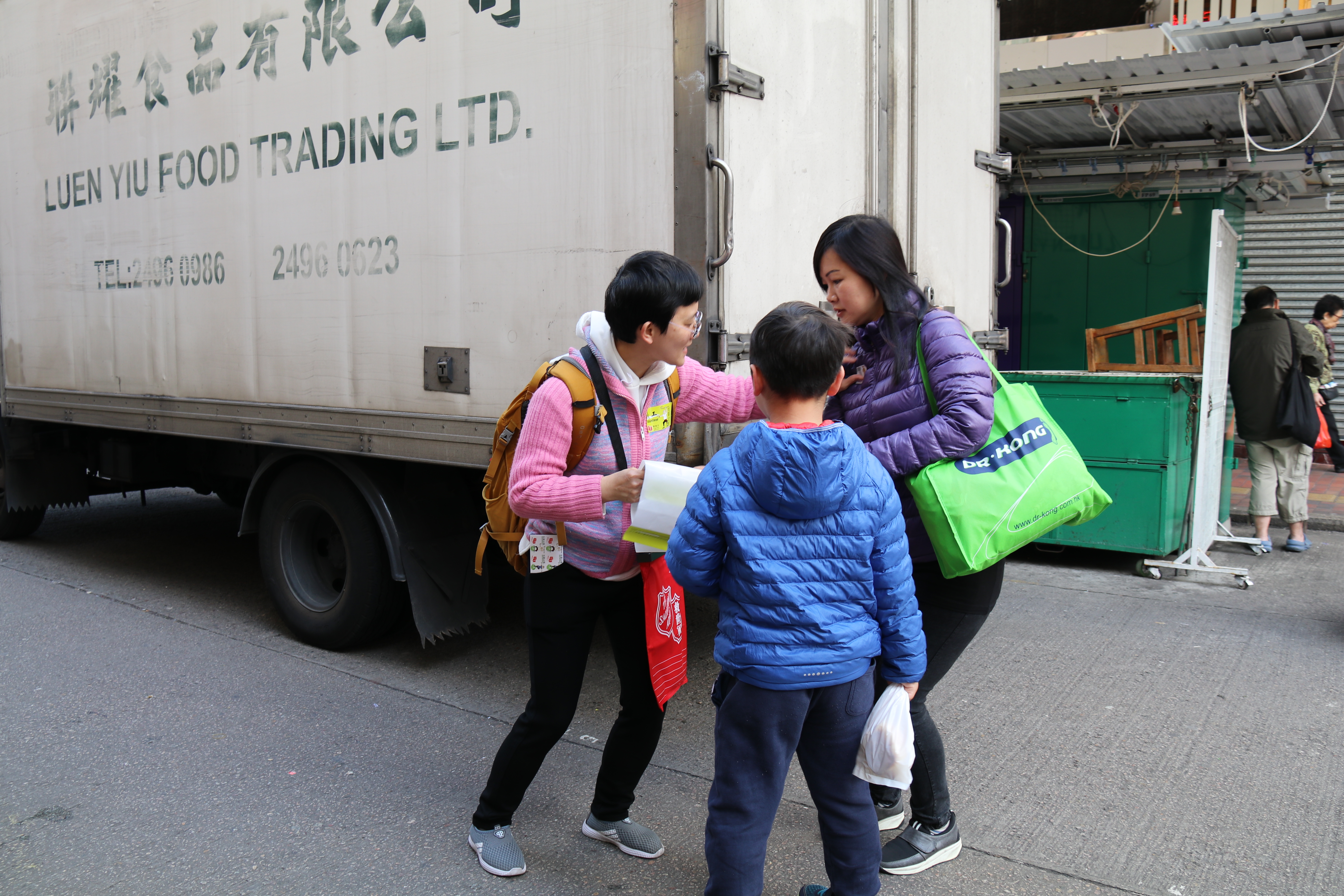 Volunteer inviting others to buy a flag
