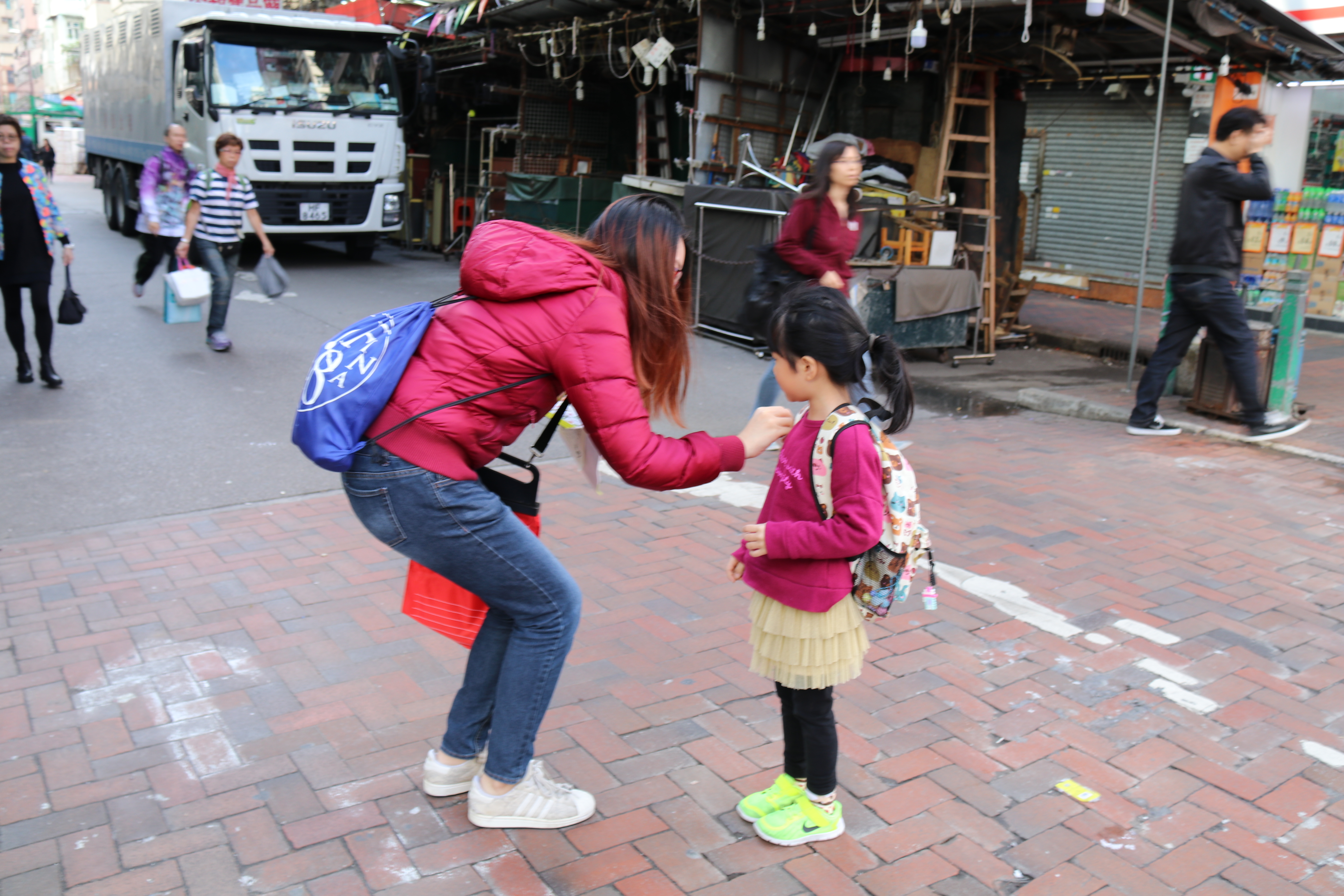 Volunteer approaching the pedestrian to buy flag