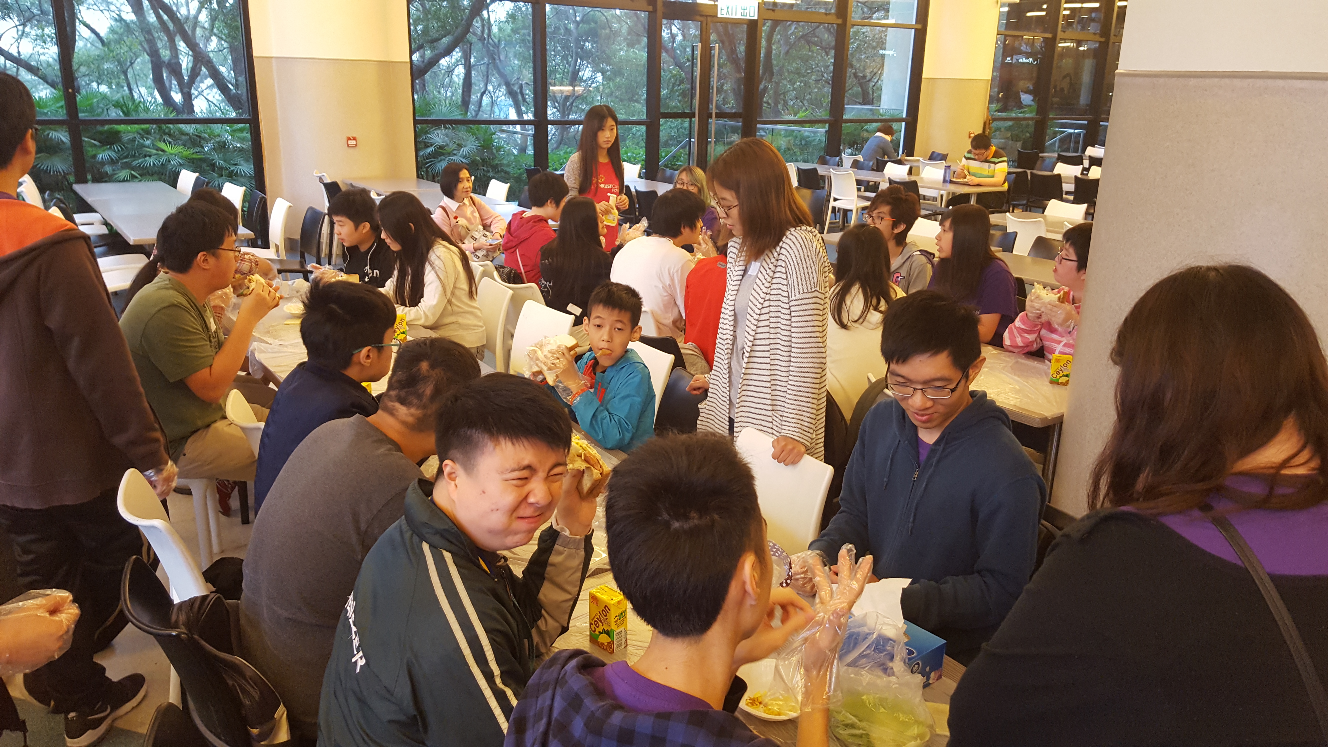 Participants enjoying sandwiches made together with the volunteers