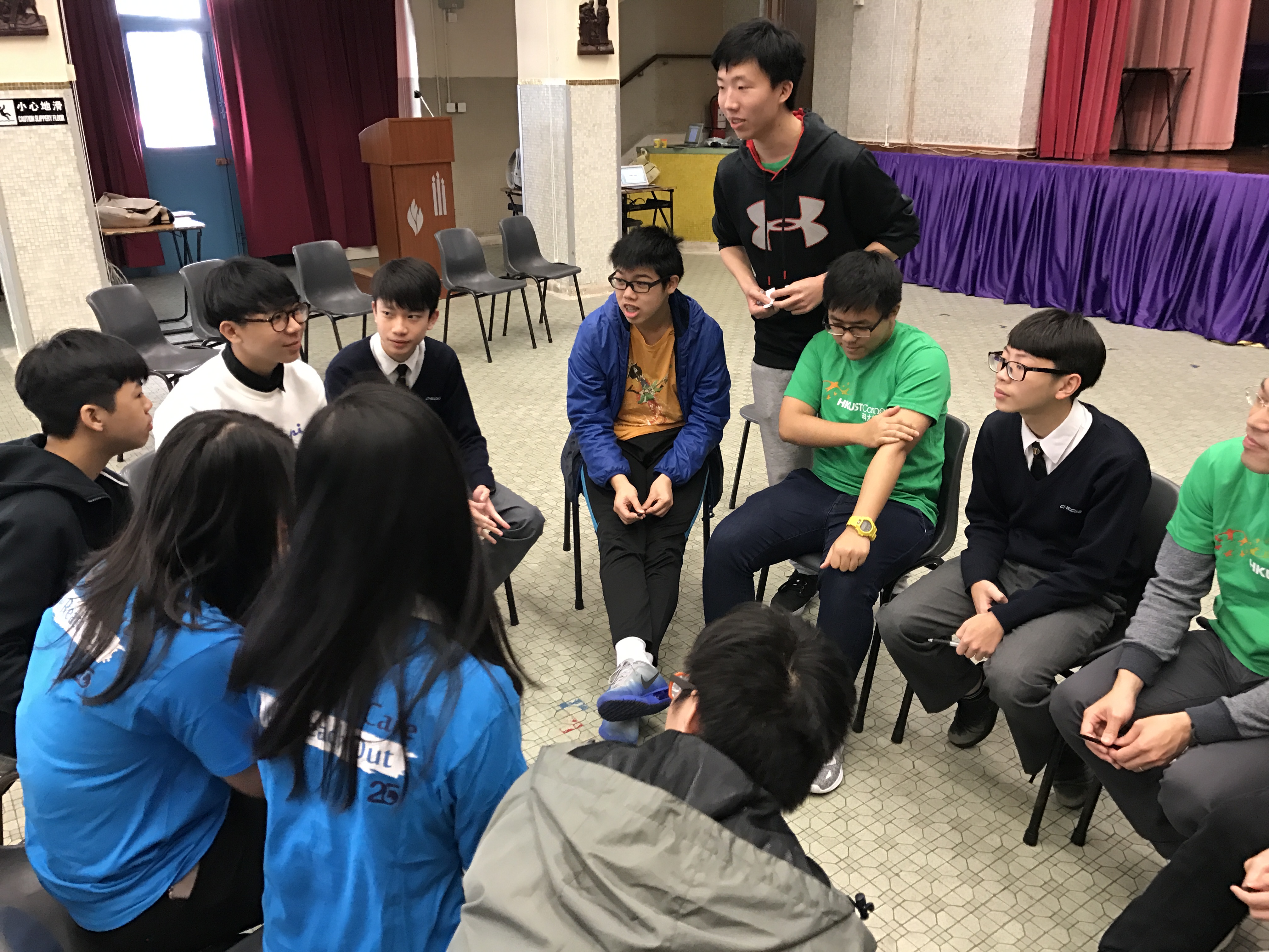 Volunteers sharing their experience with the teenagers
