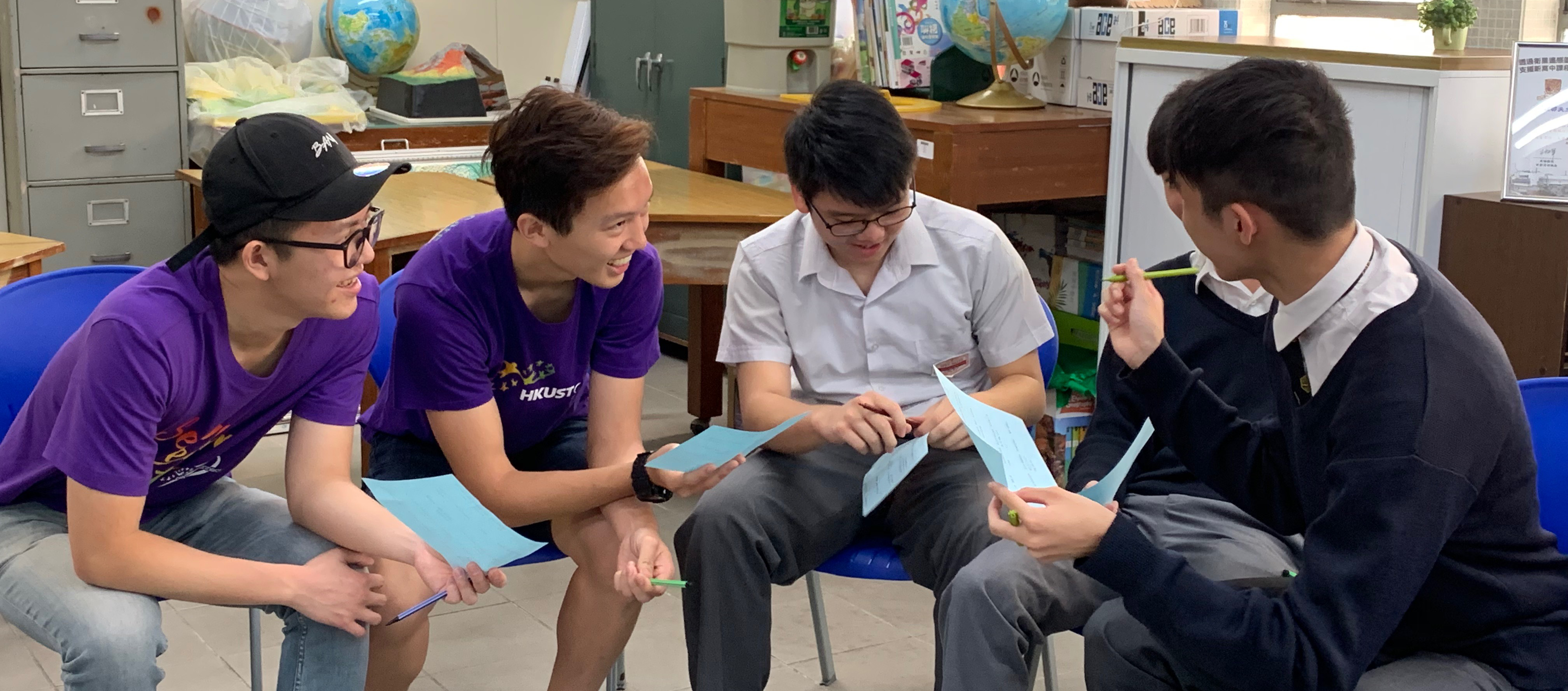 Volunteers sharing their experience with secondary school students