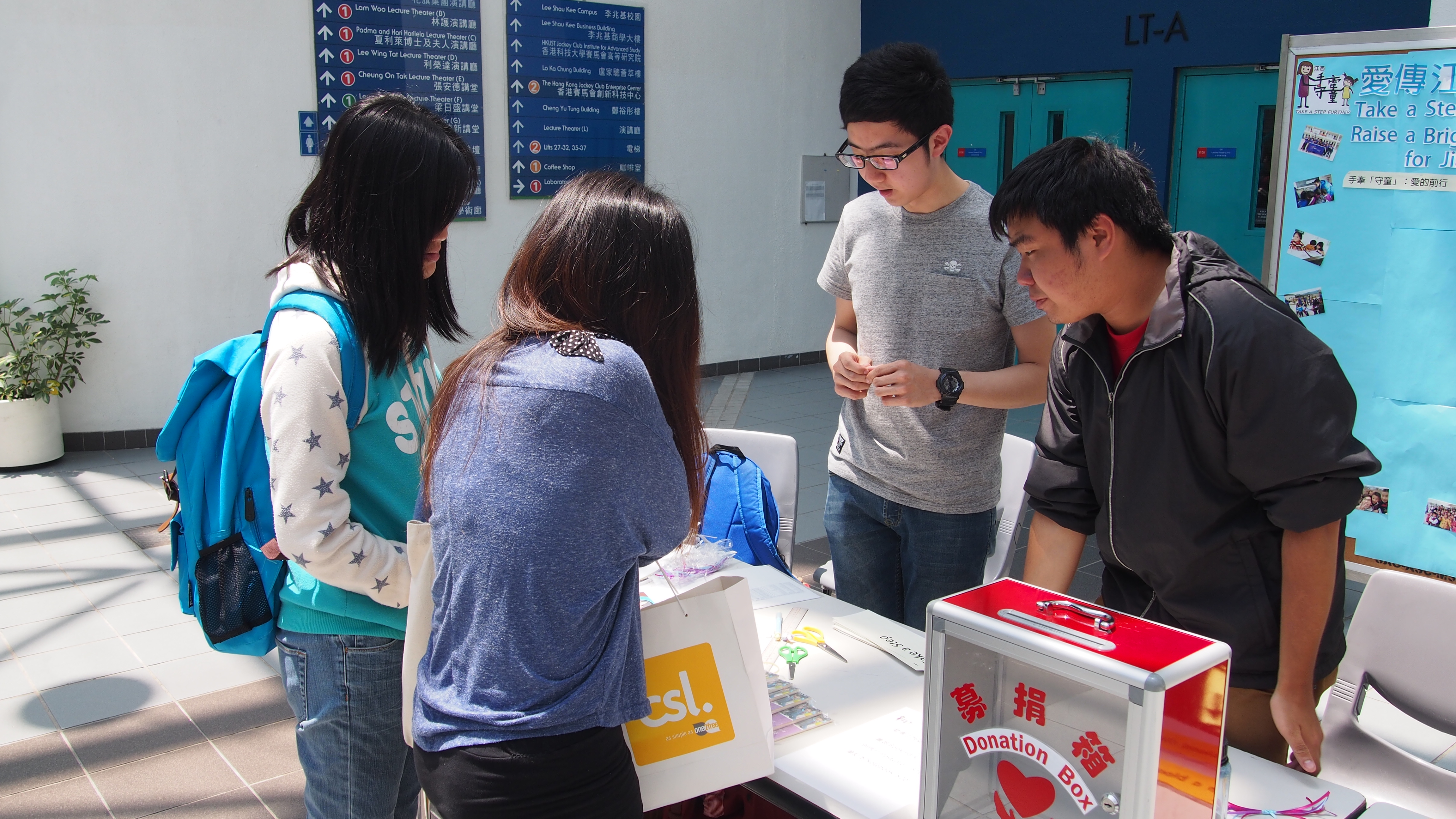 Students being informed about the service by the volunteers