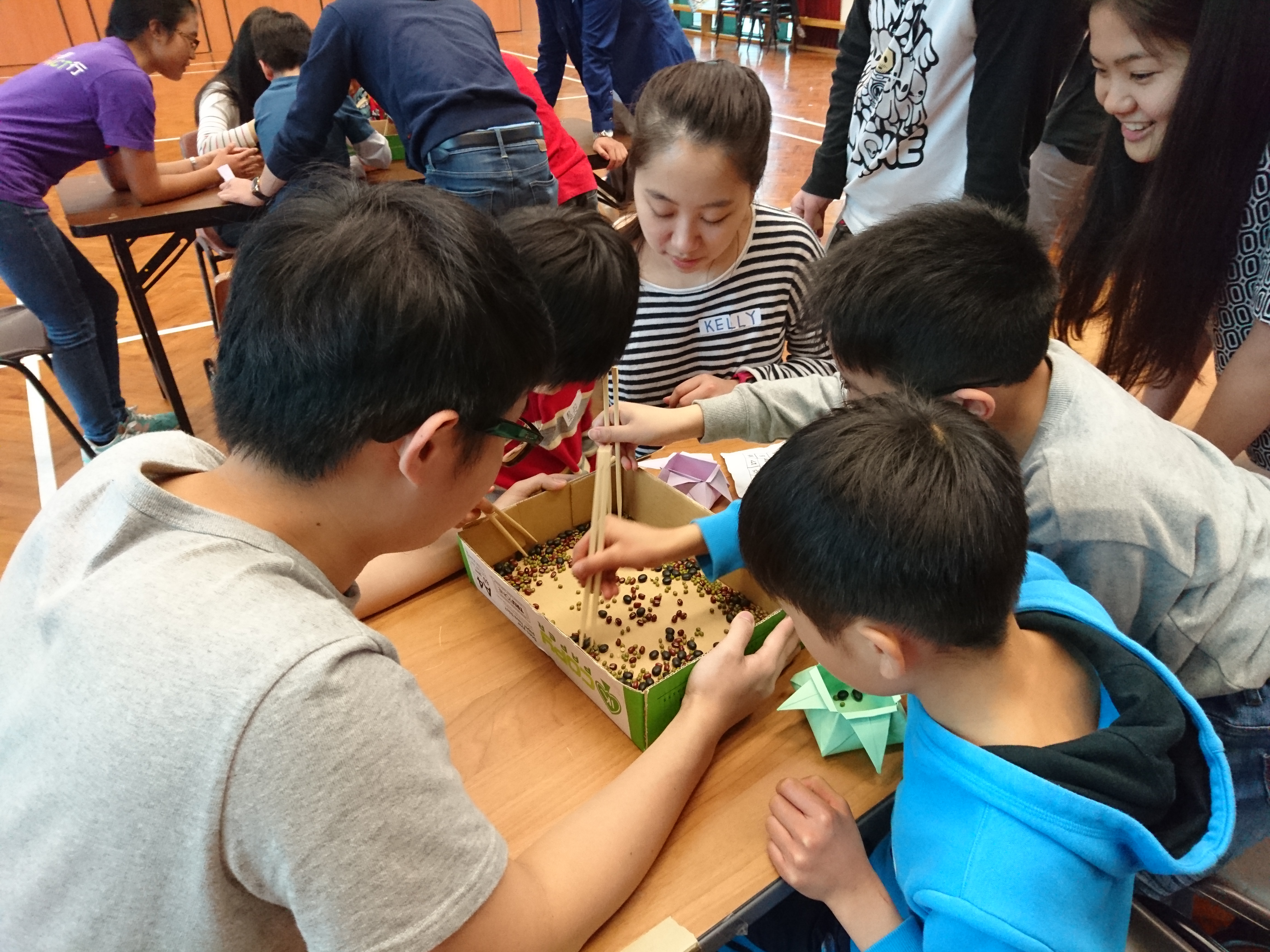 Volunteers leading a game for the children