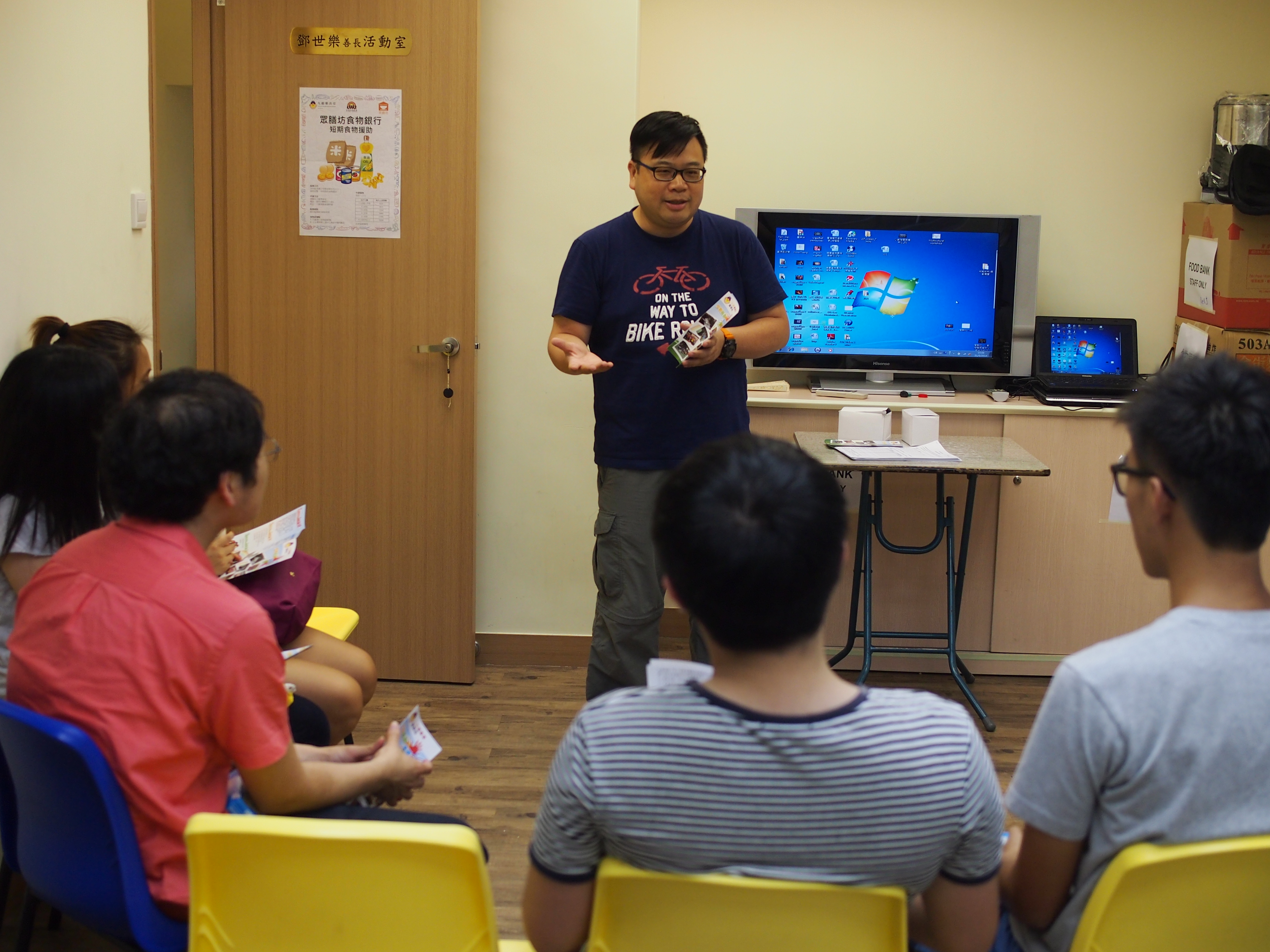 Volunteers being briefed by the social worker from the center