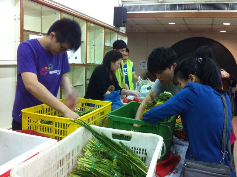 Volunteers helping to sort and distribute the vegetables in the centre