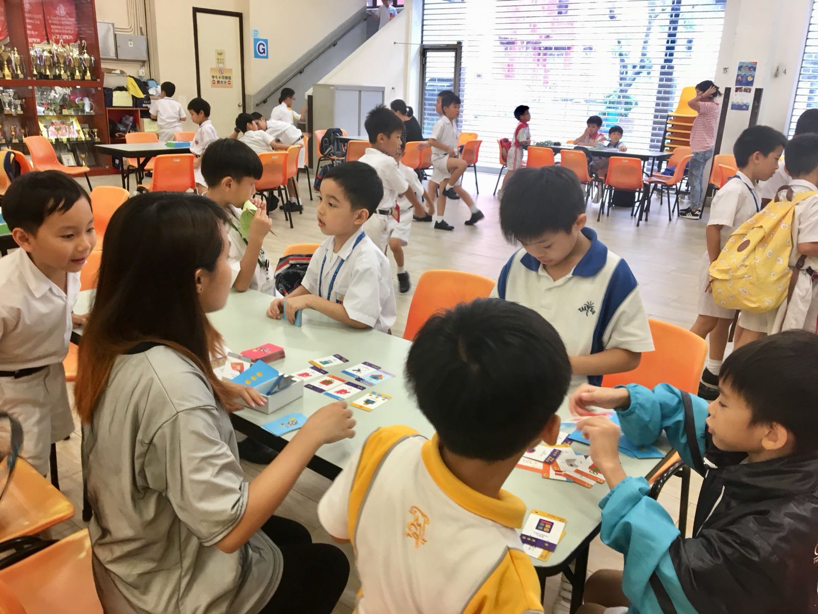 Student volunteer leading a booth game