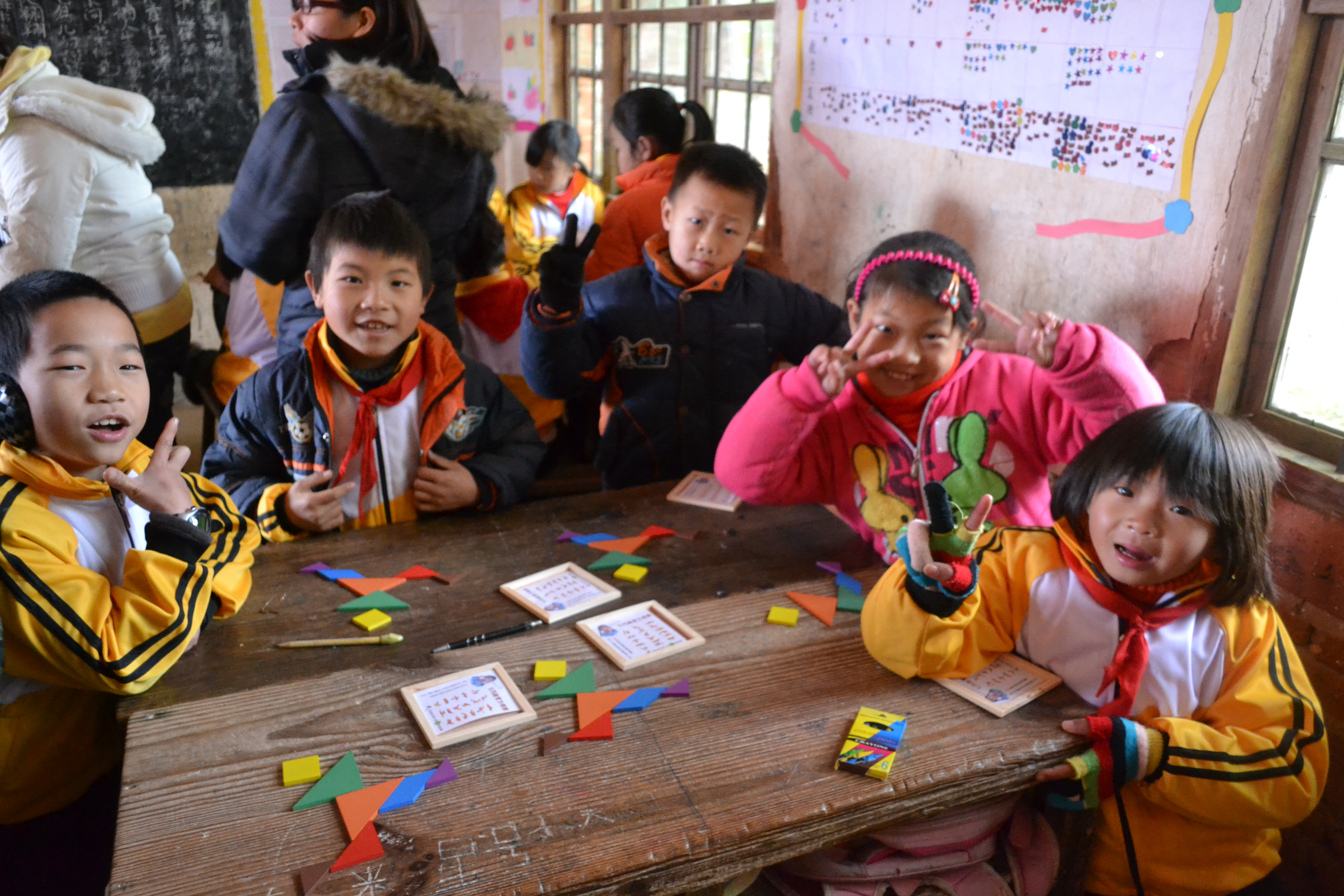 Children playing with tangram puzzles to strengthen their cognitive skills  