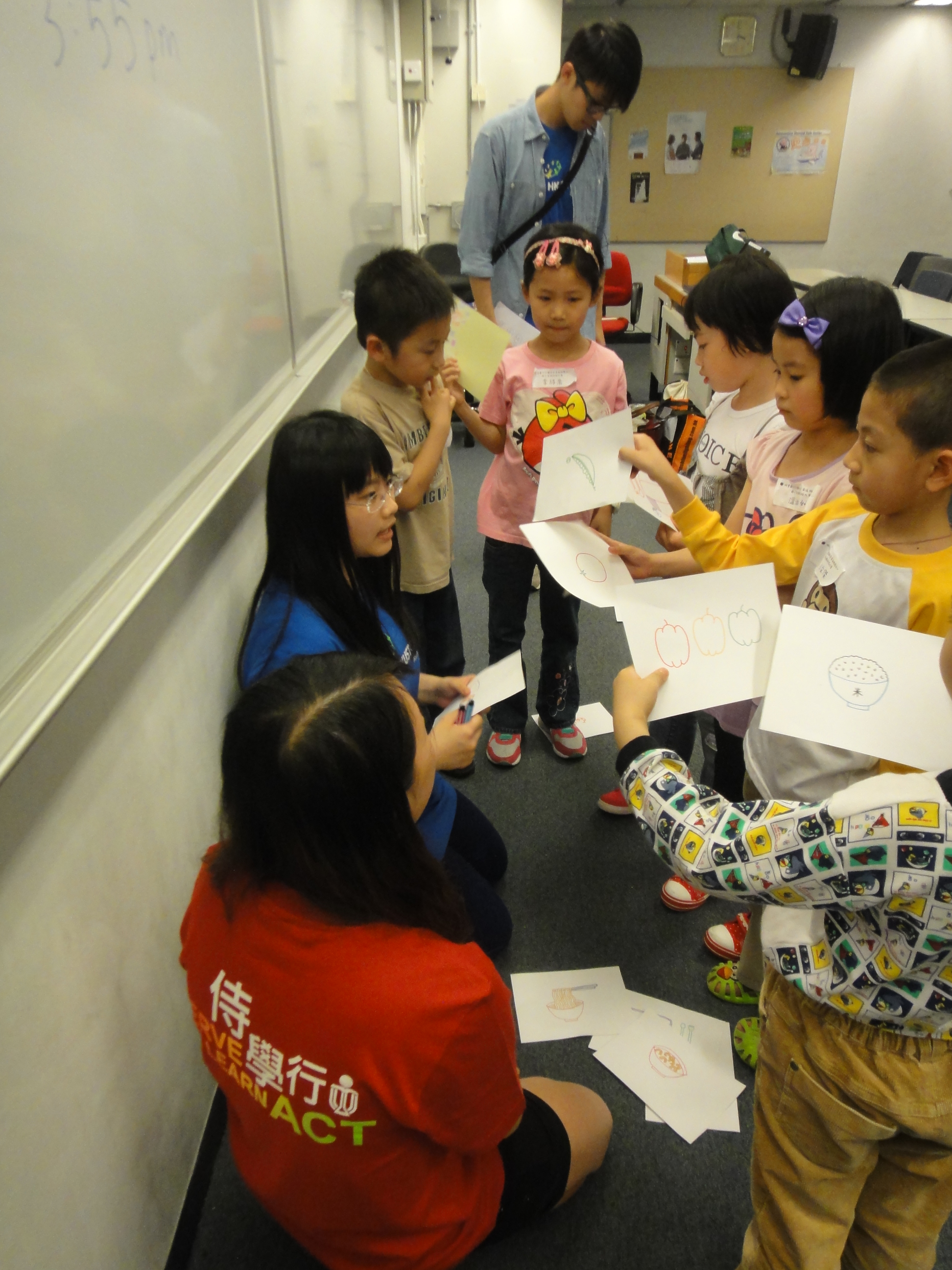 Children sharing their favorite food with our volunteers