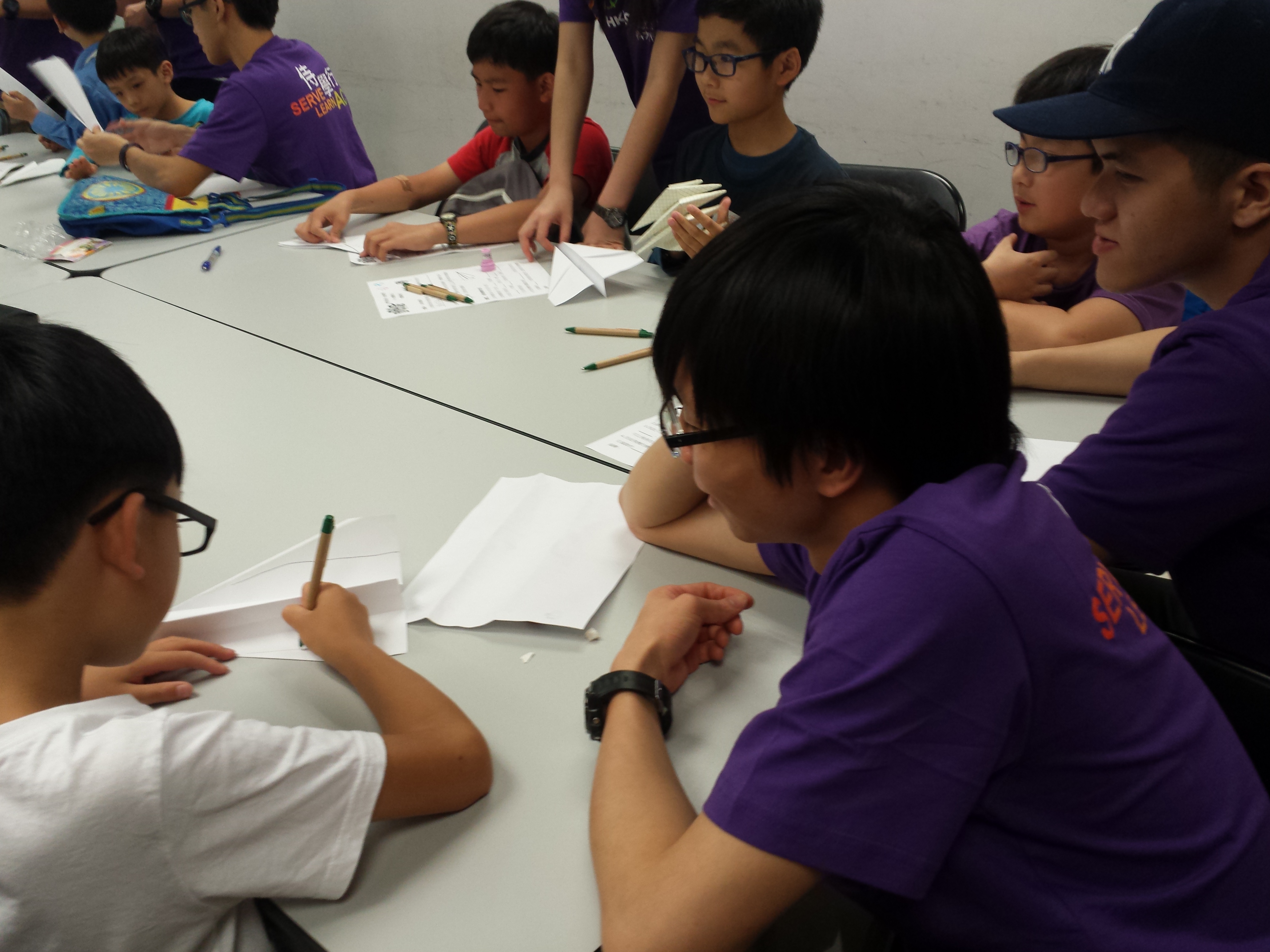 Volunteer drawing with children