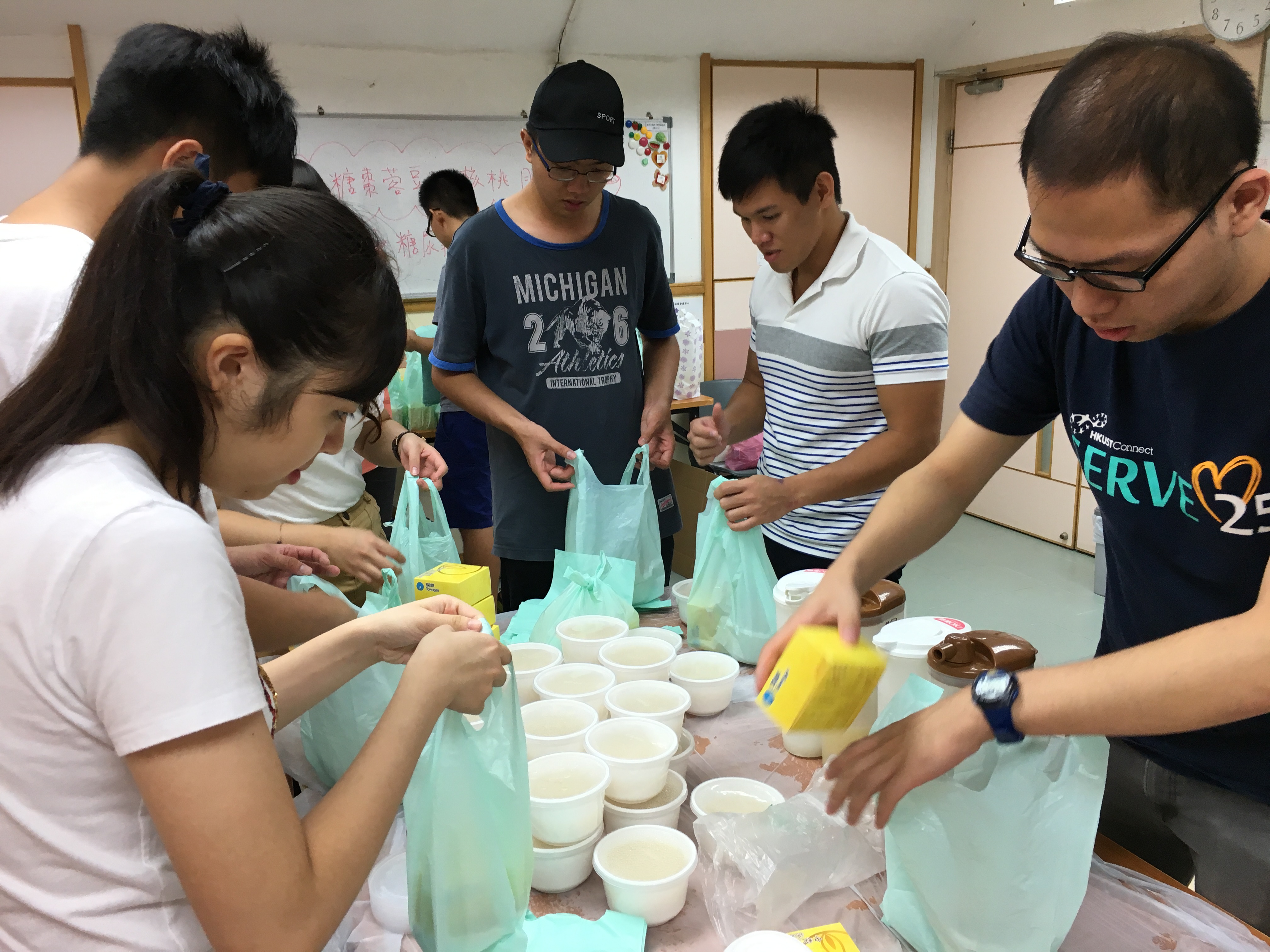 Volunteers preparing the soup for elderly