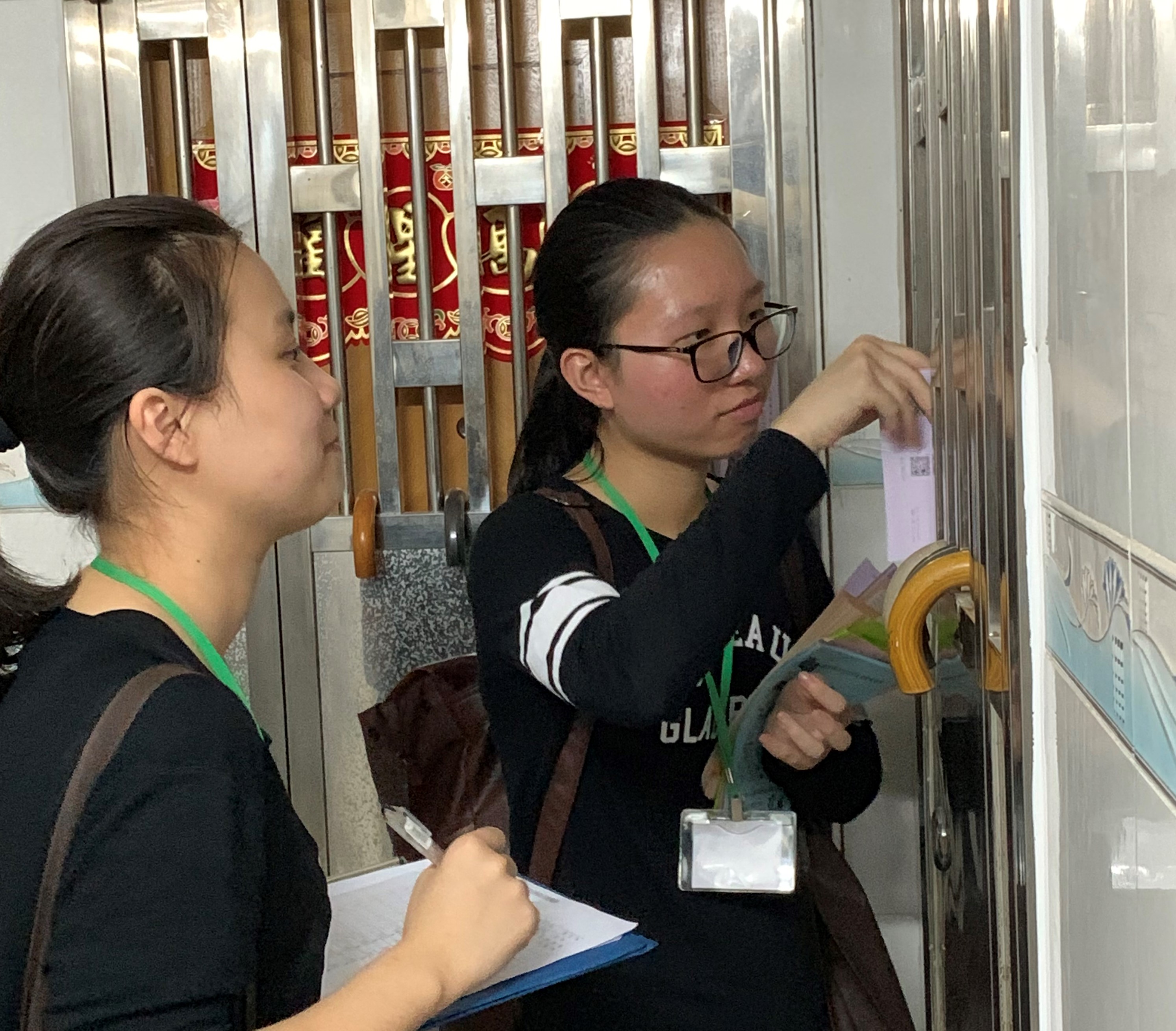 Volunteers approaching a household living in a subdivided housing unit