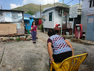 Volunteer conducting health assessment of the elderly
