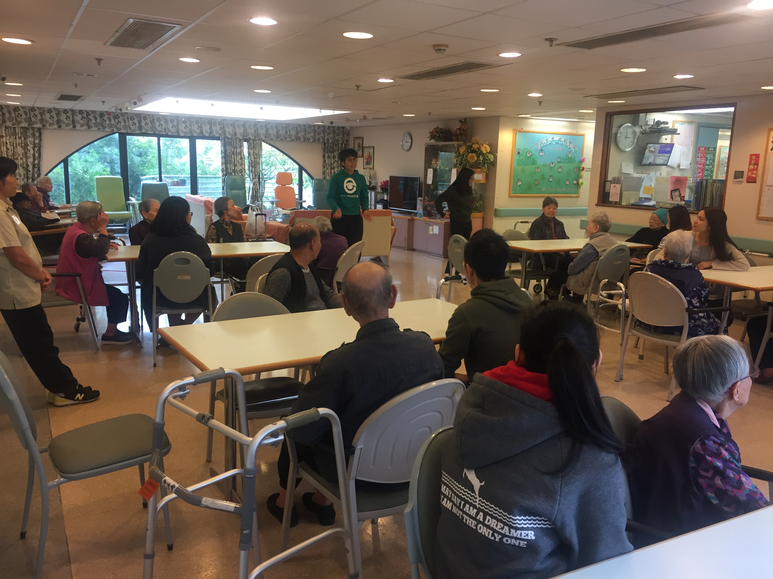 Volunteers playing games with elderly