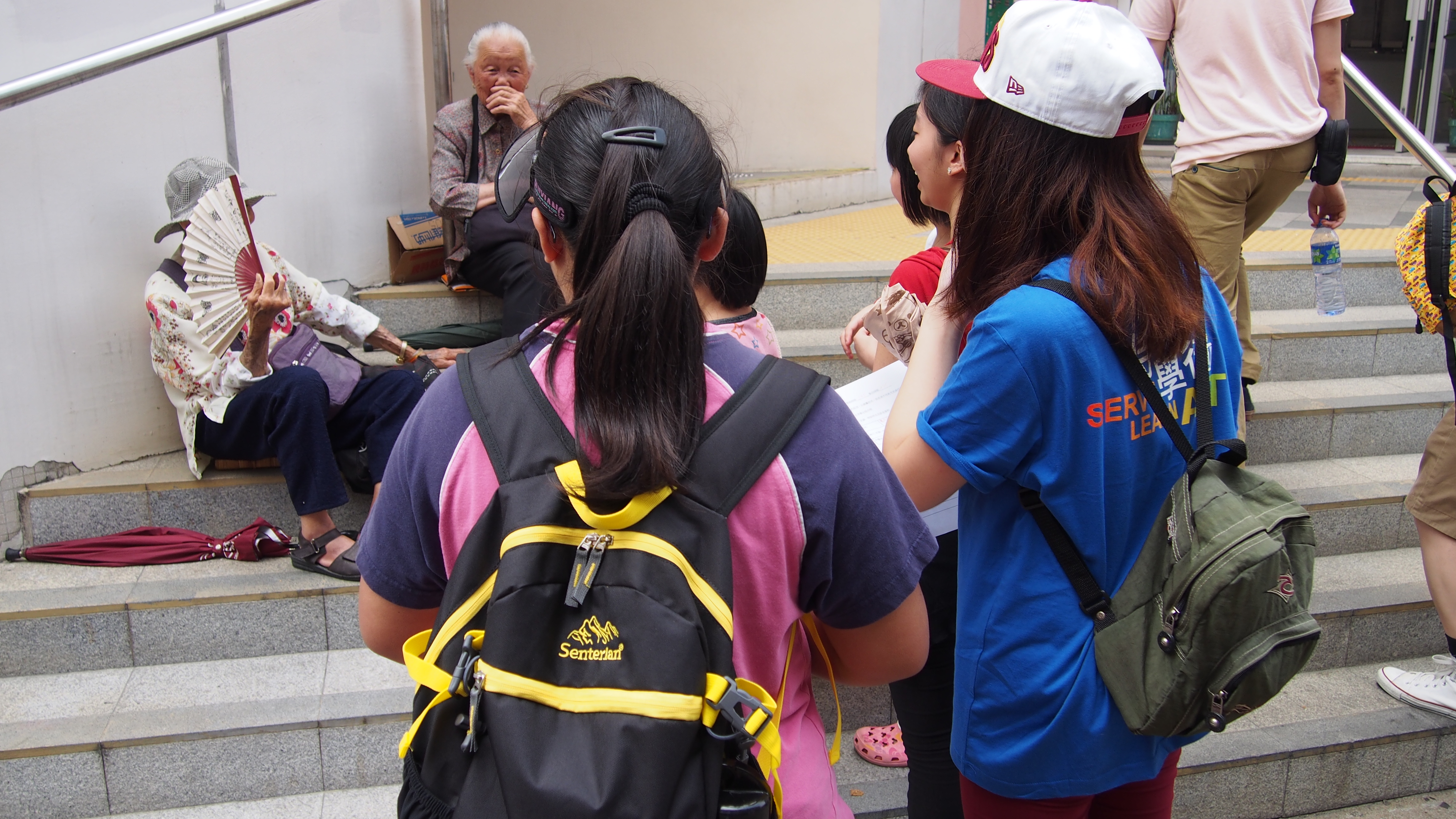 Our volunteers and children talking with elderly to know more about their life