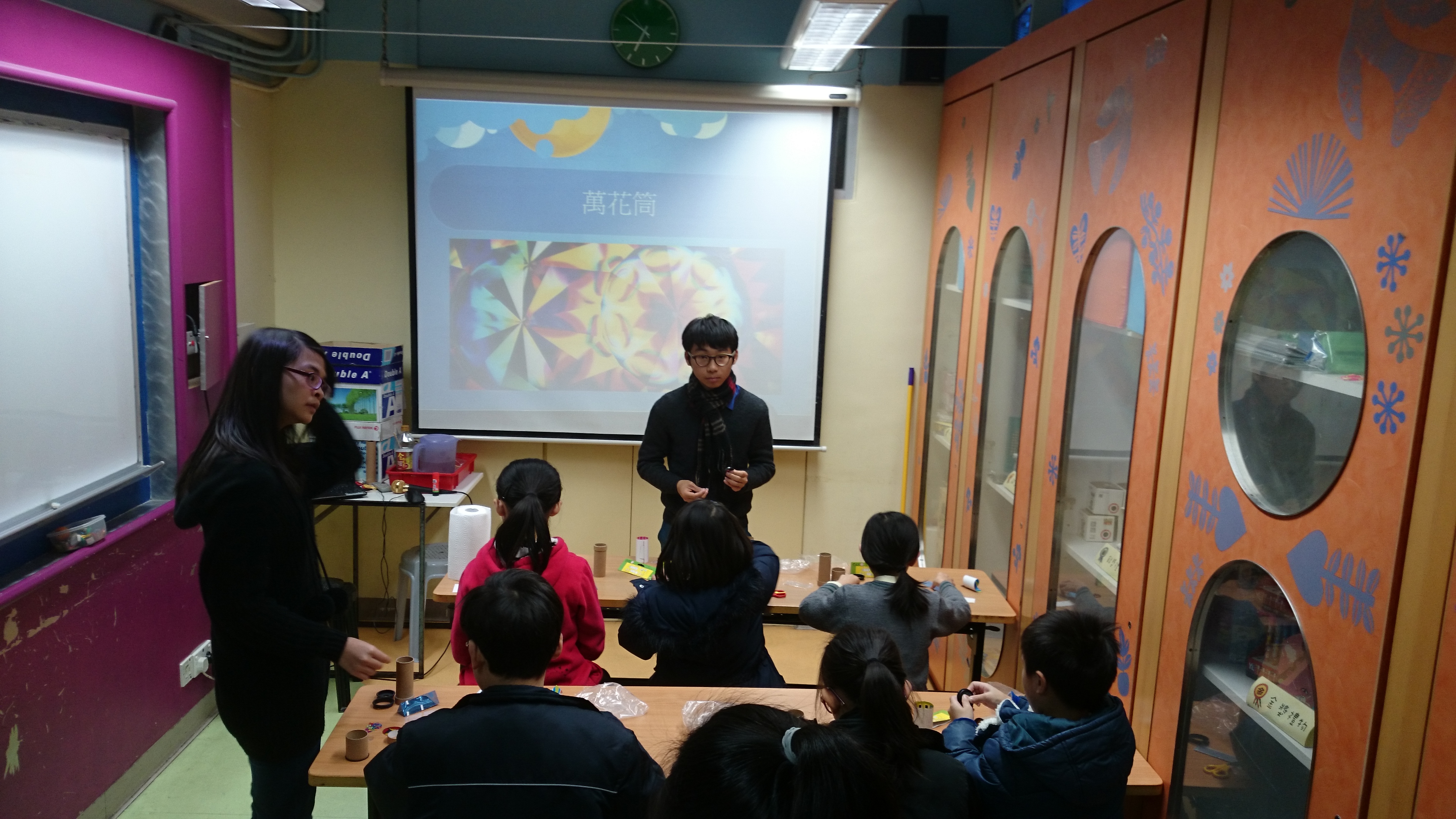 Children doing kaleidoscope to learn more about the properties of light