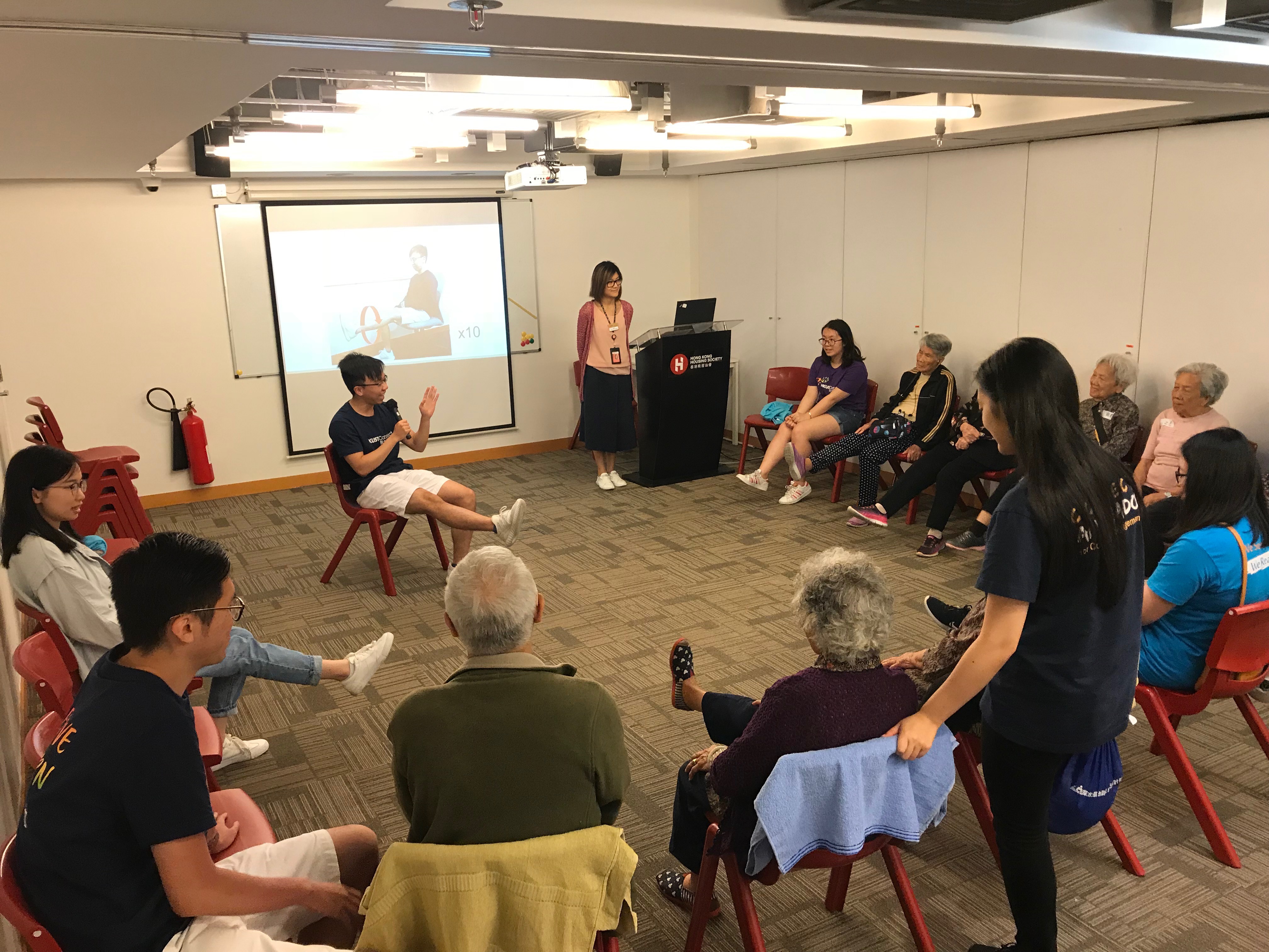 Elderly learning exercise with volunteers
