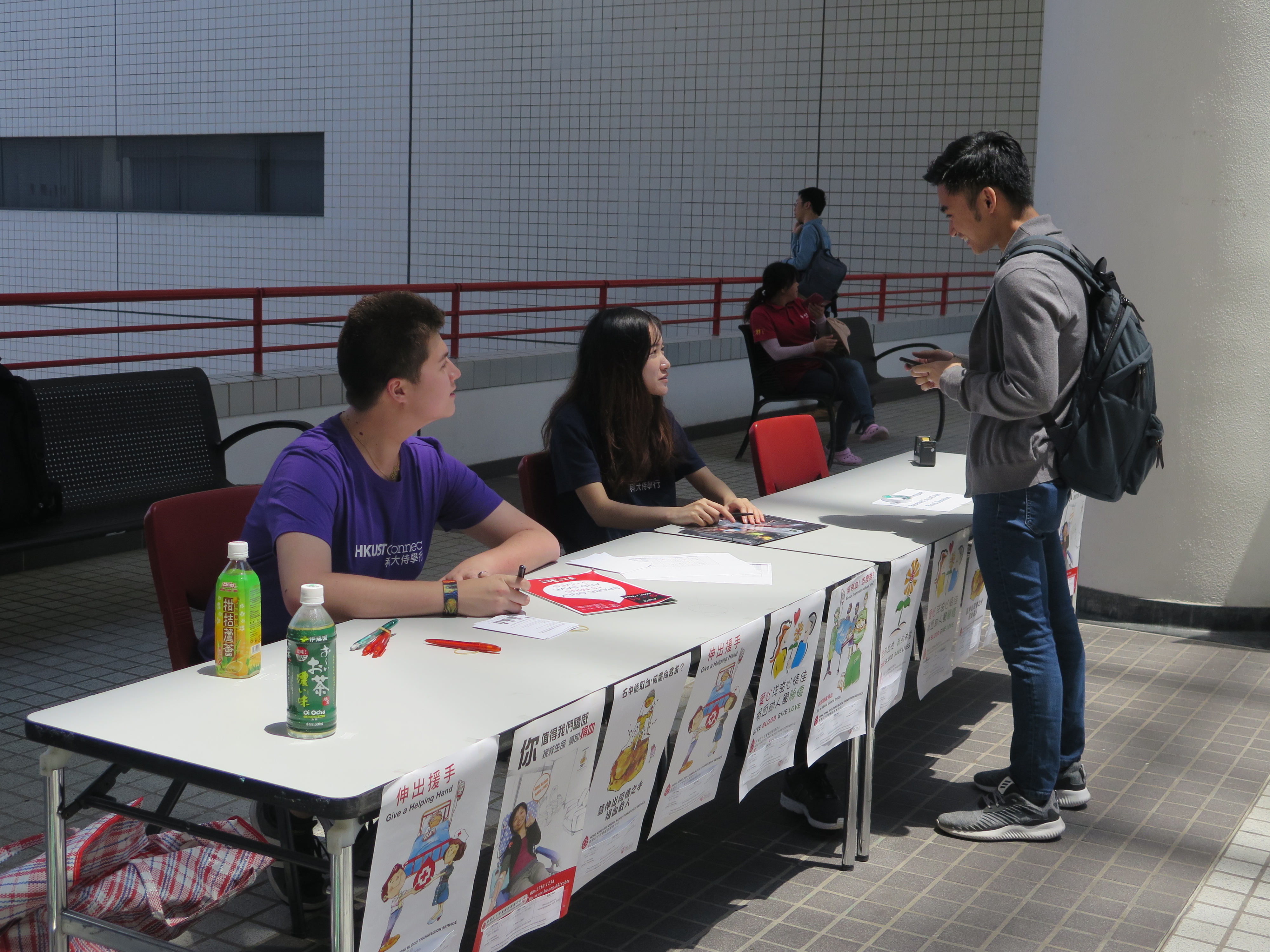 Volunteers promoting the event at the information booth