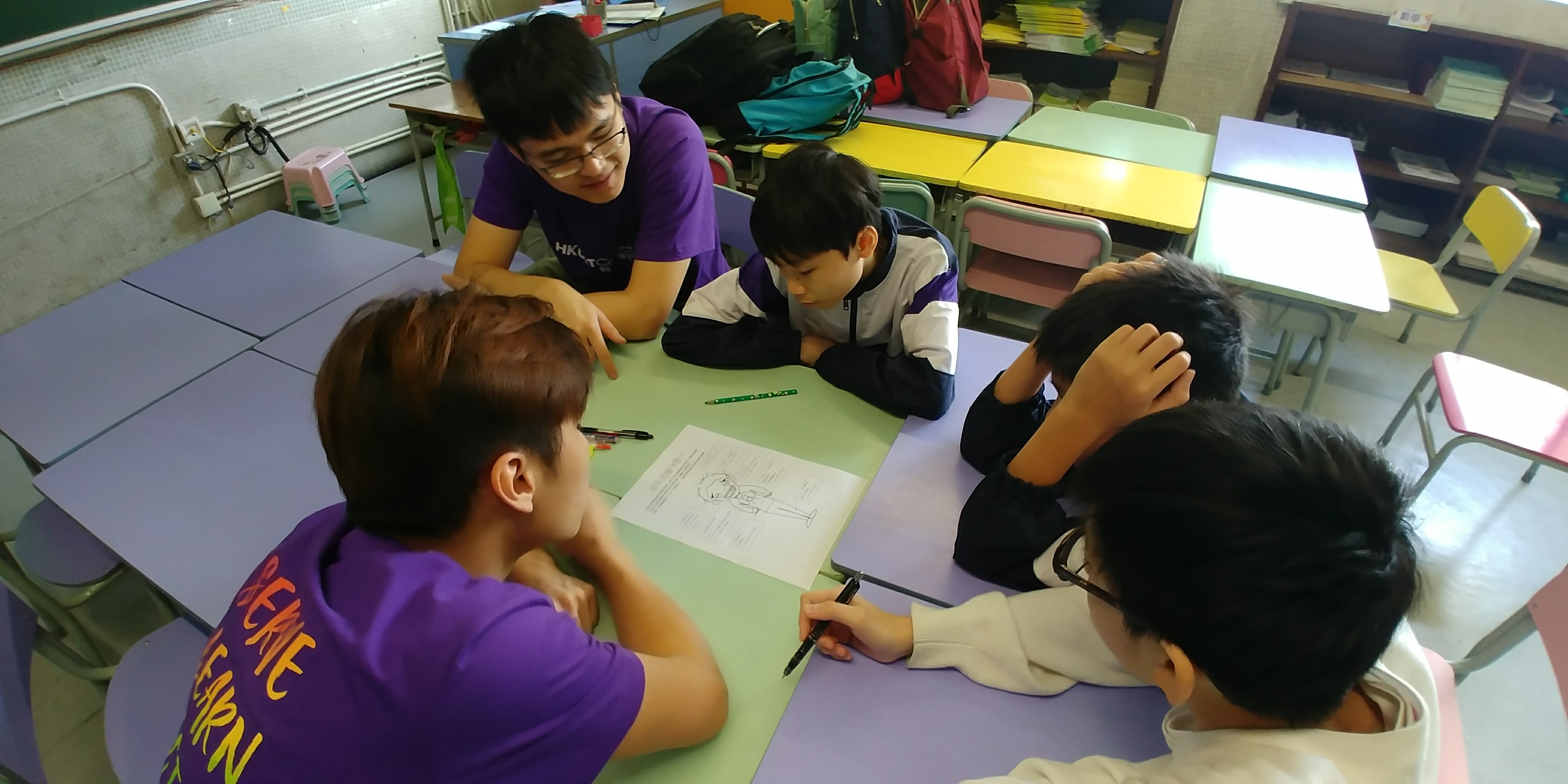 Volunteers teaching science.