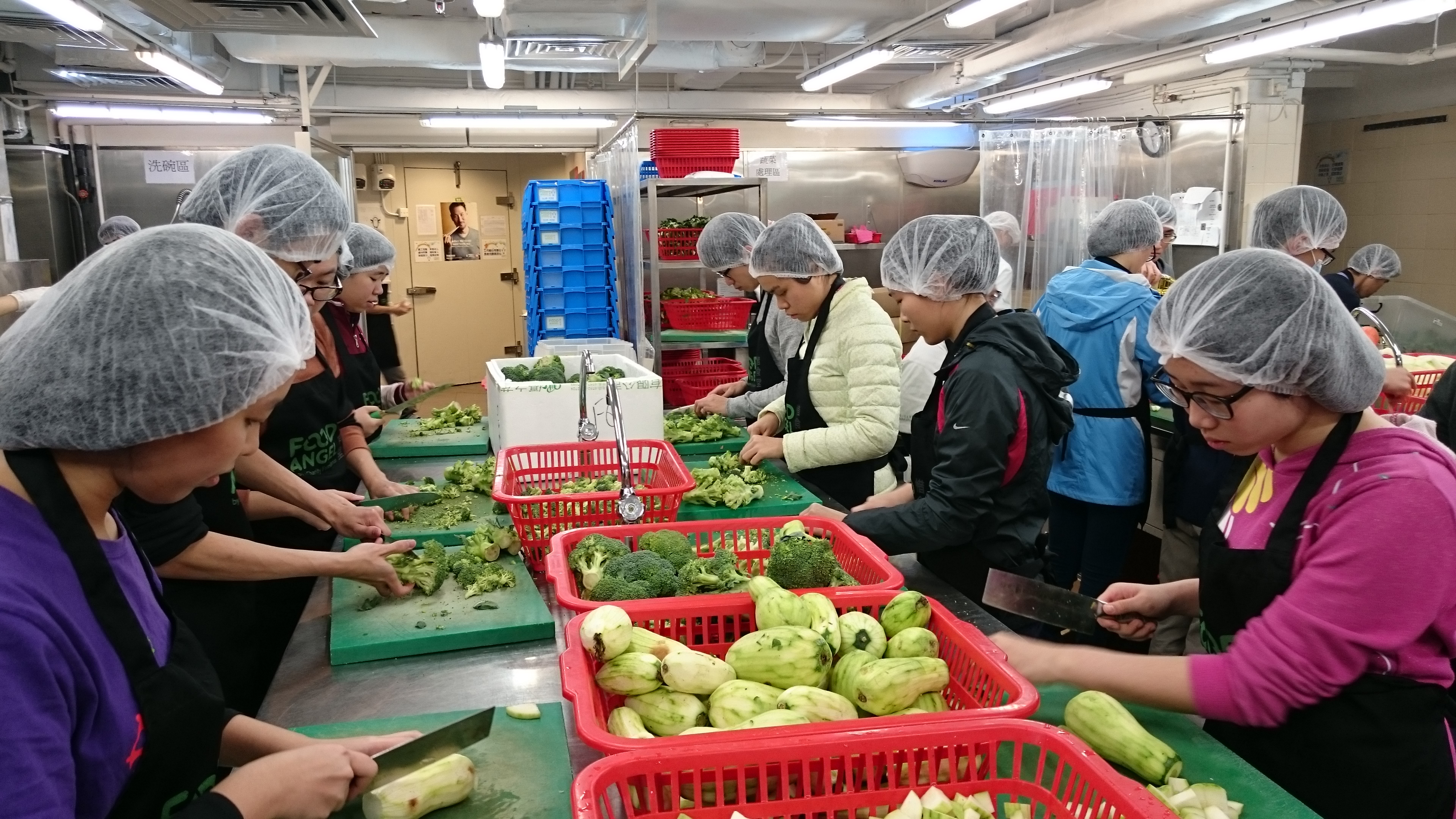 Our student volunteers chopping vegetables for the meal box