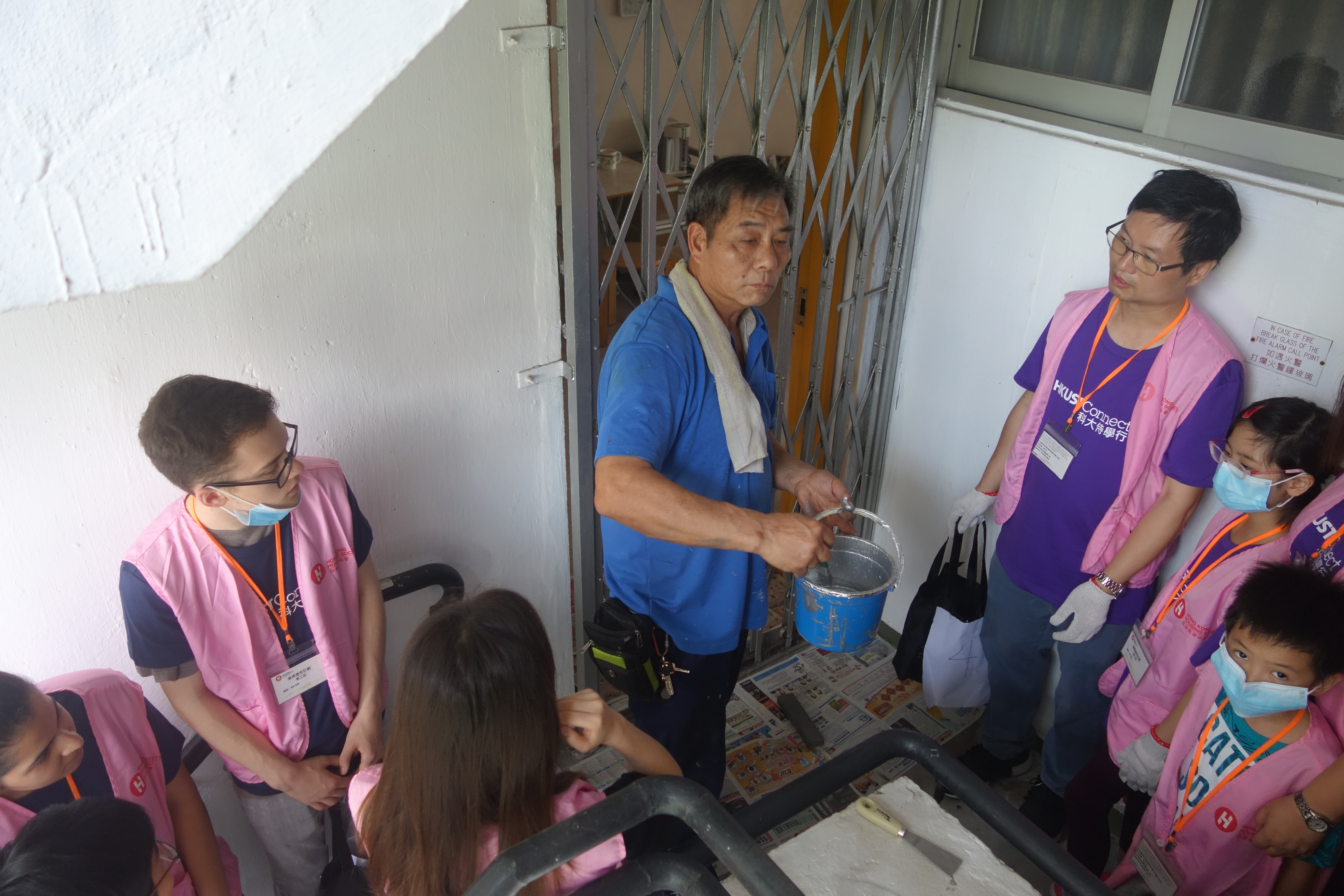 Volunteers are learning how to maintain metal gates.