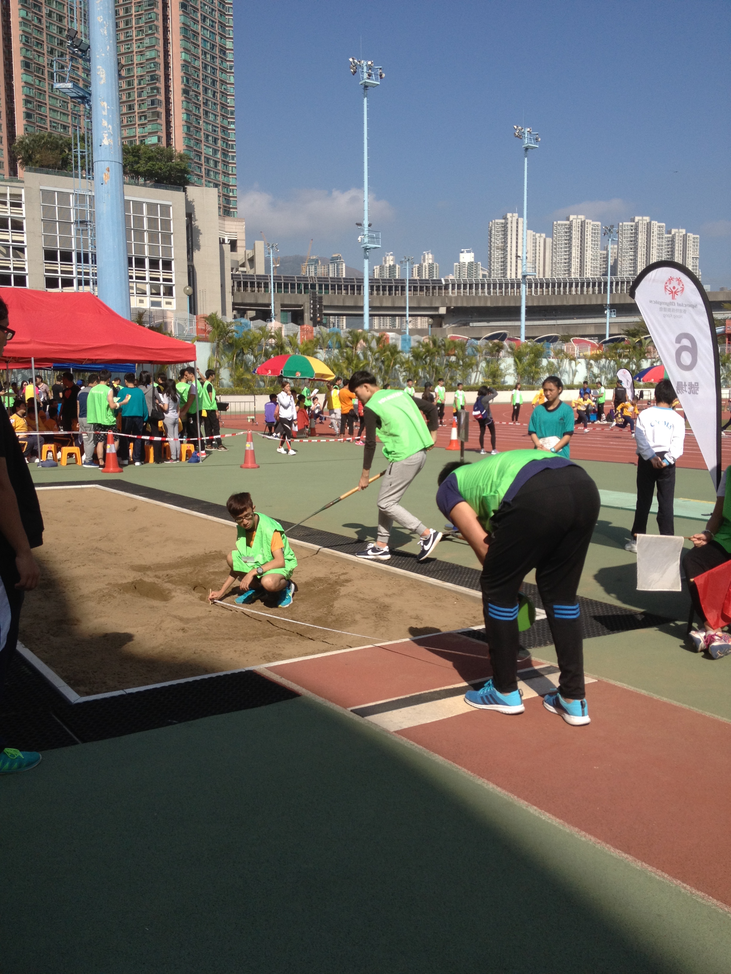 Volunteers measuring the length of the jump