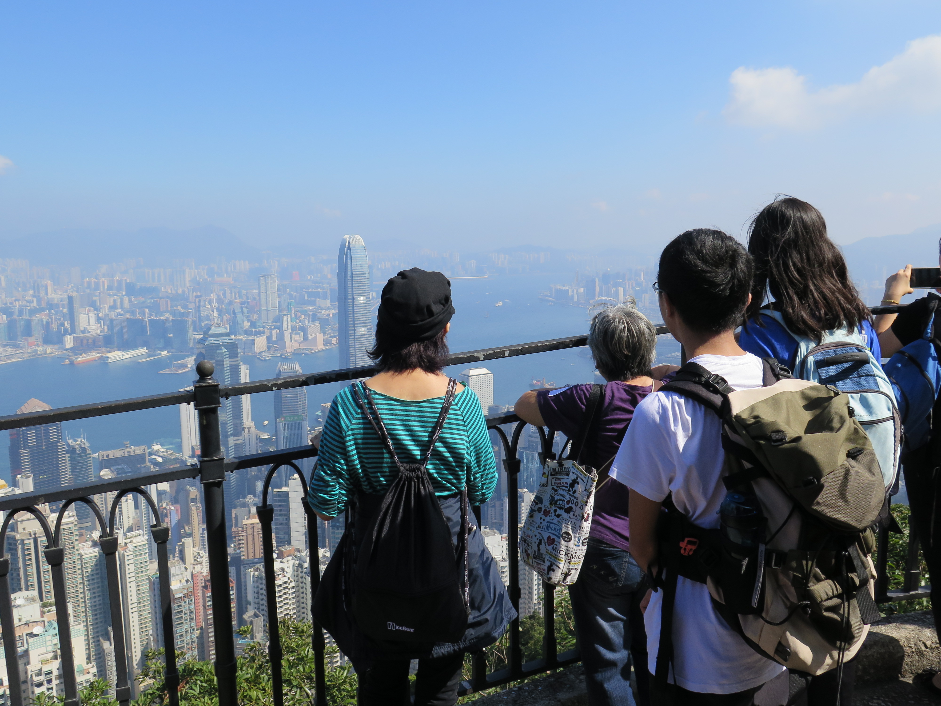 Students and the elderly enjoying the beautiful scenery  of the Victoria Harbour.