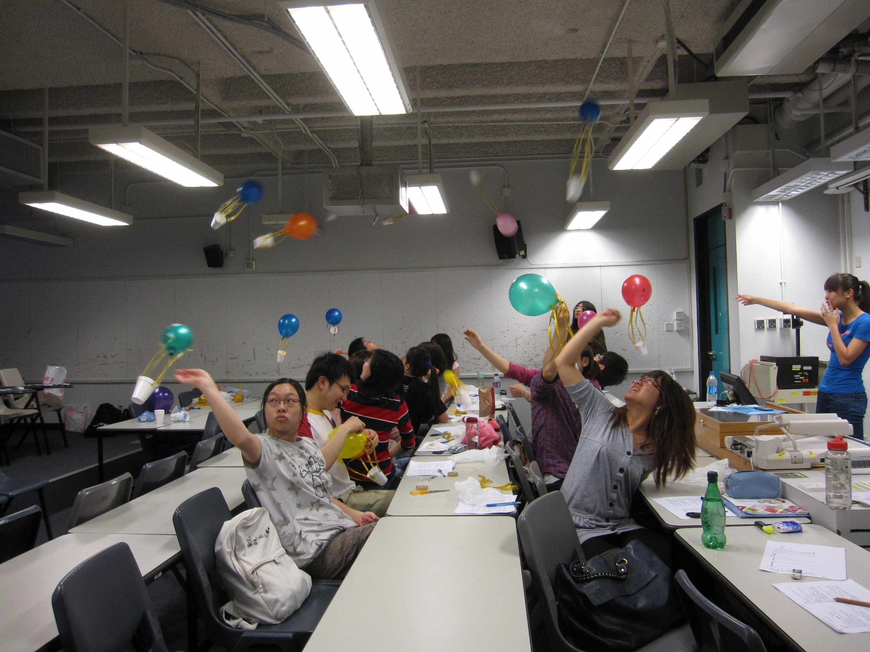 Volunteers testing out and refining their teaching experiments before departure