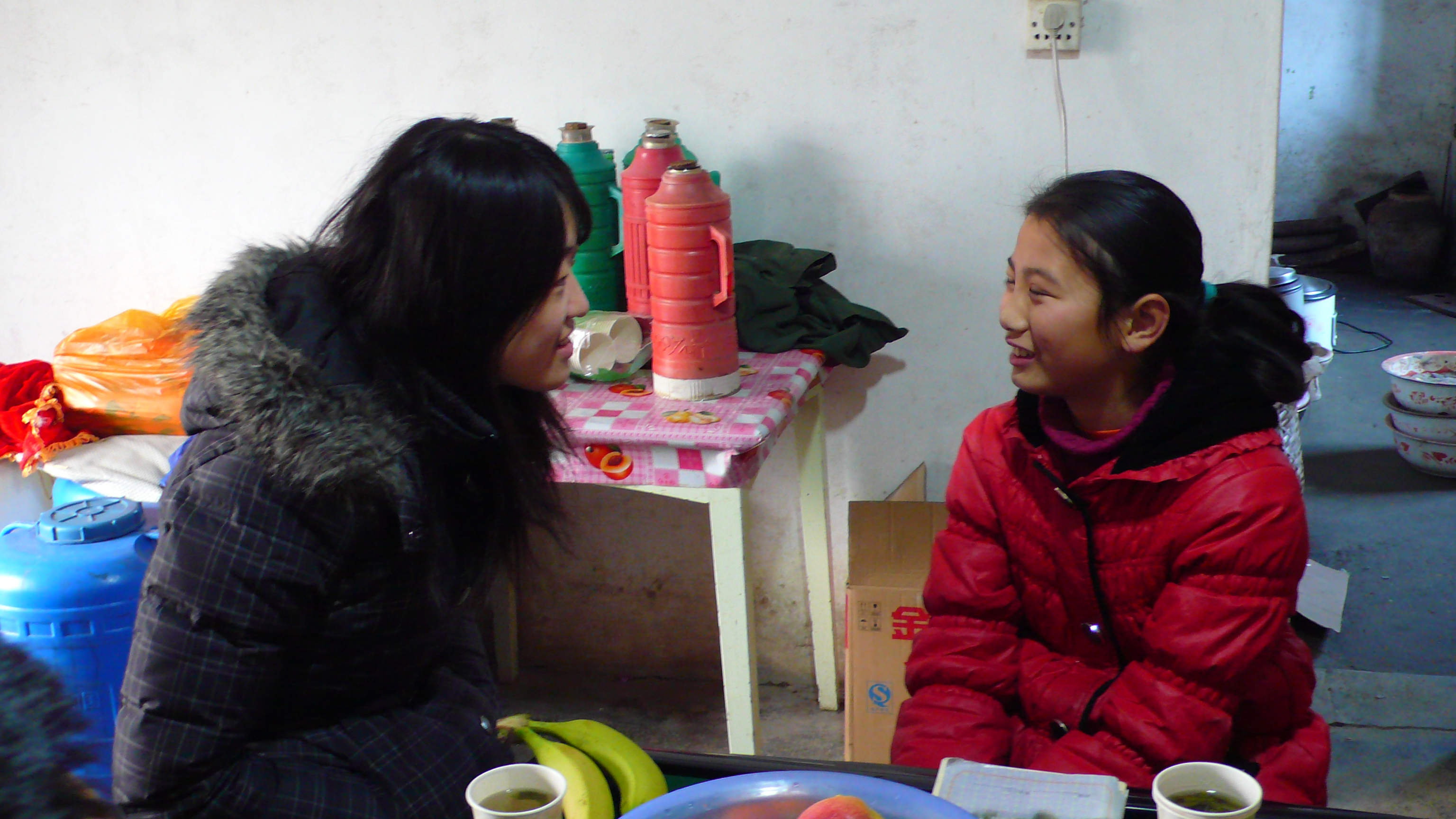 Volunteers visiting a local student's family to learn more about their lives