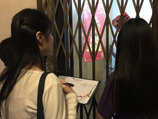 Volunteers recording the needs of household living in subdivided unit