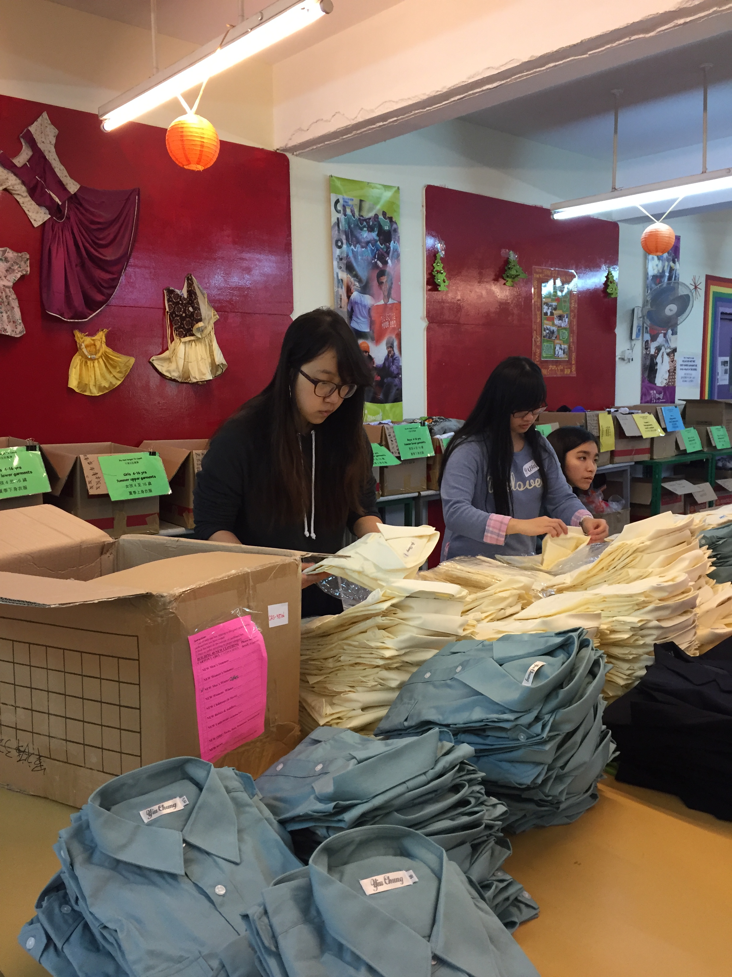 Volunteers re-packing the uniform according to different sizes