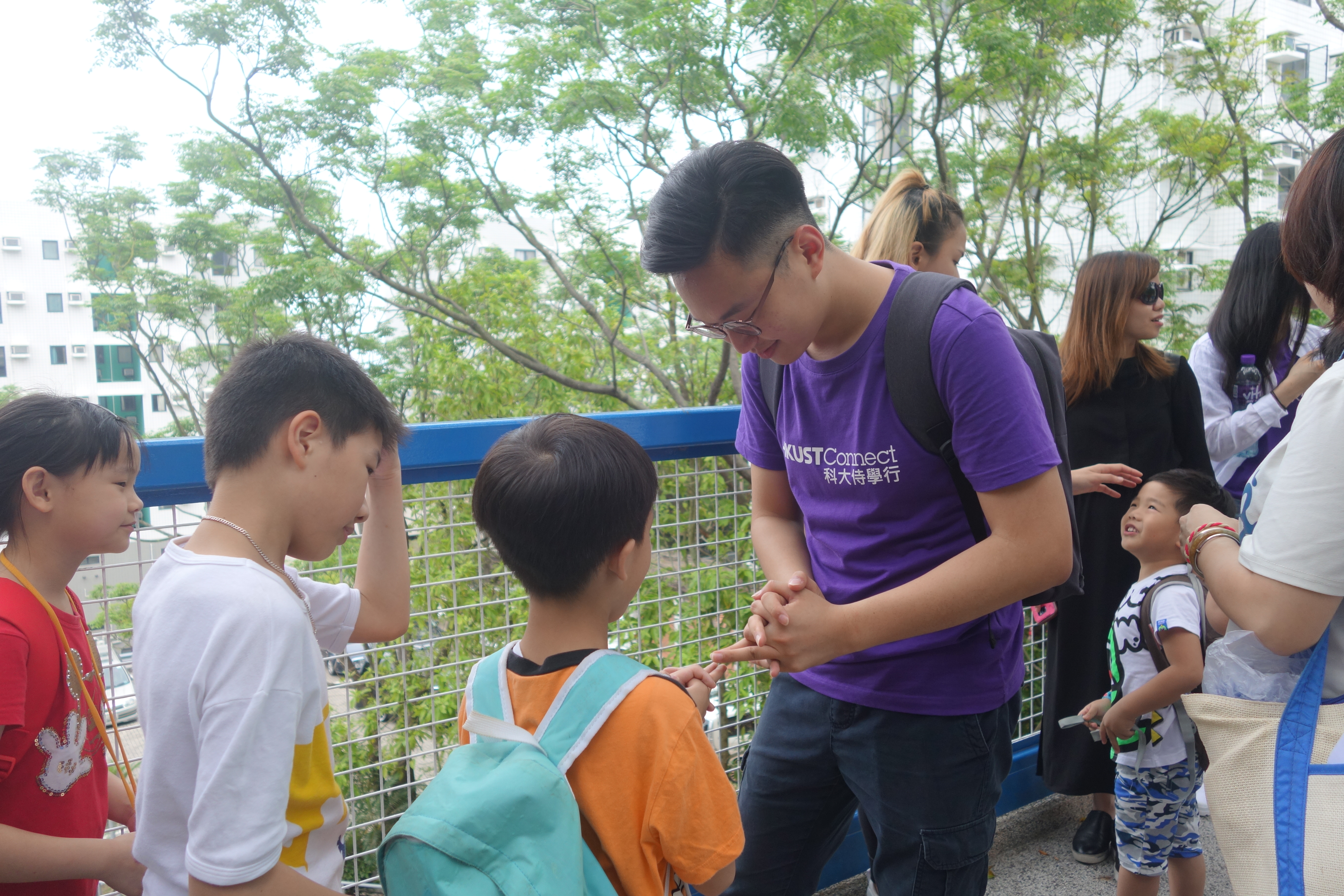 Volunteers playing different games with kids during a campus tour