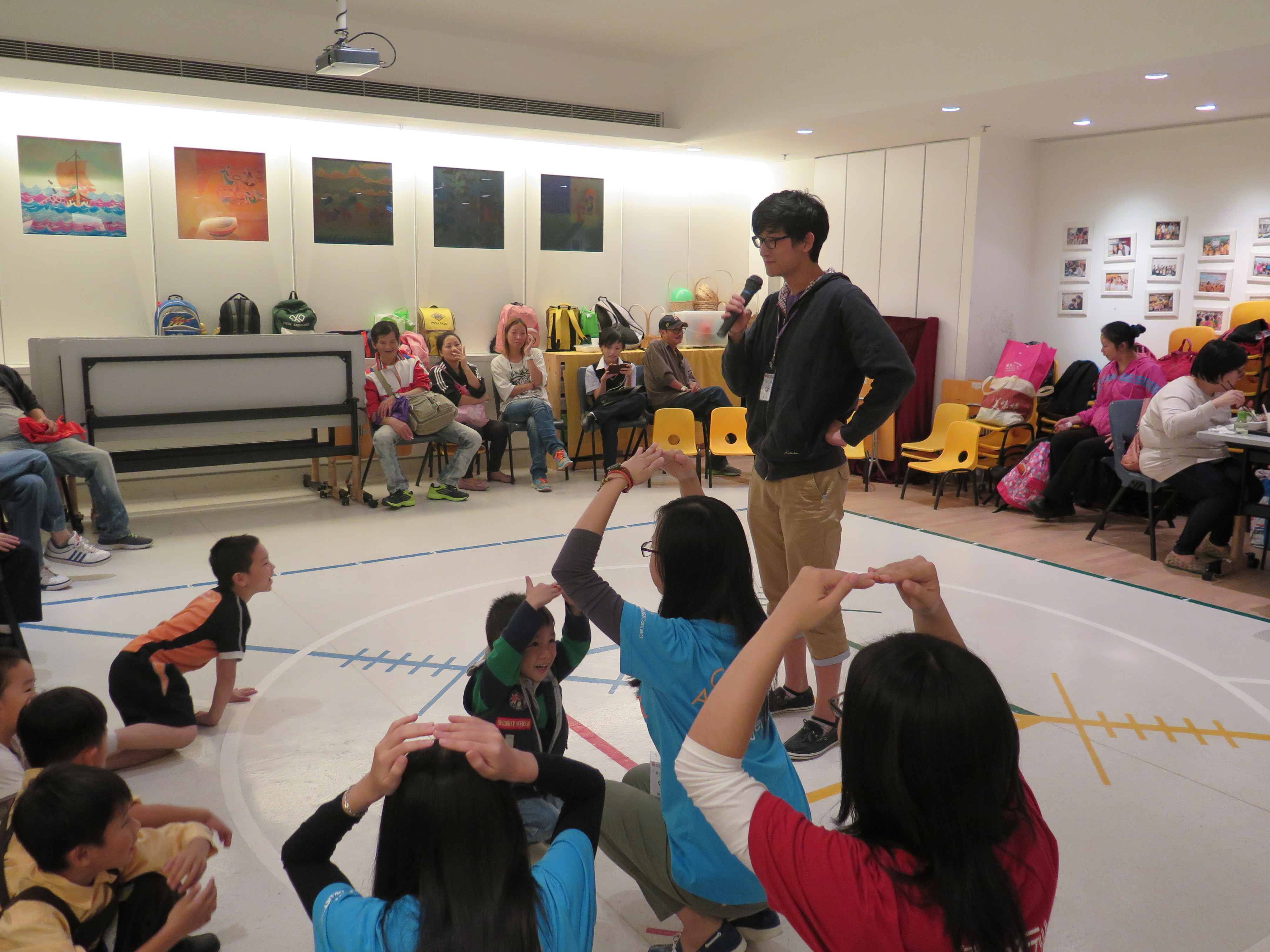 Volunteers playing games with the kids