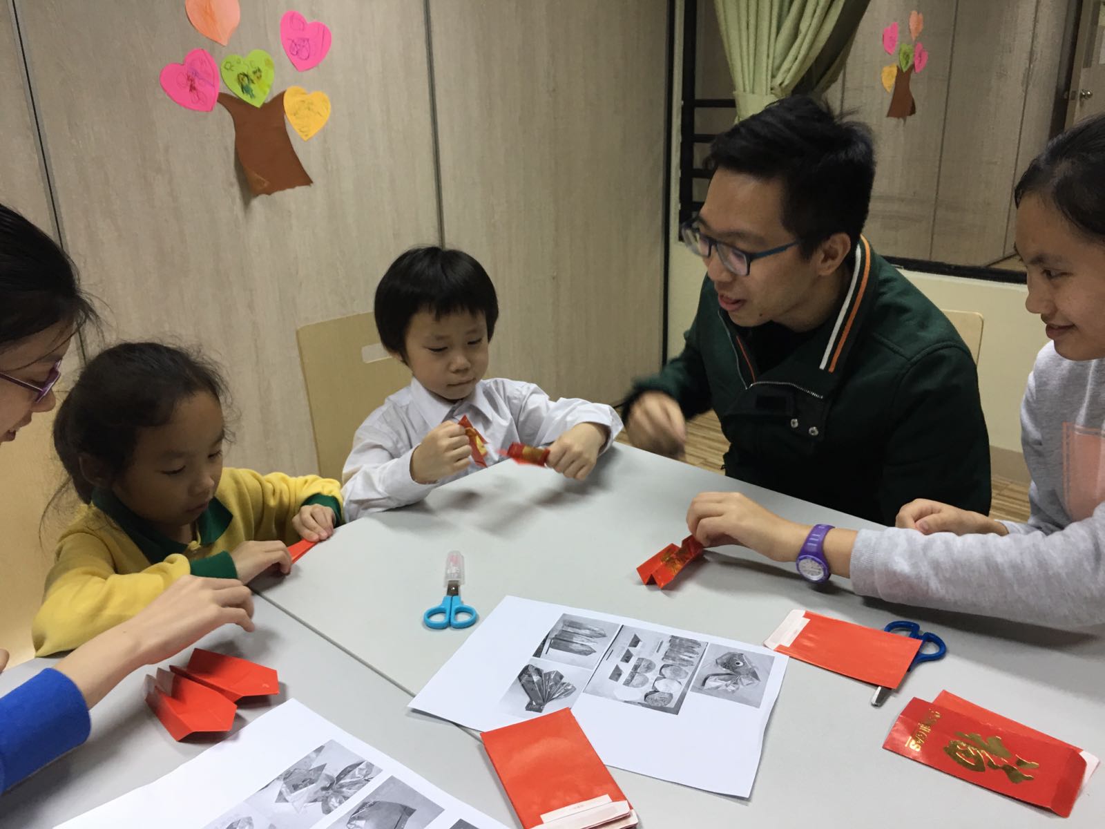 Volunteers teaching children with their homework