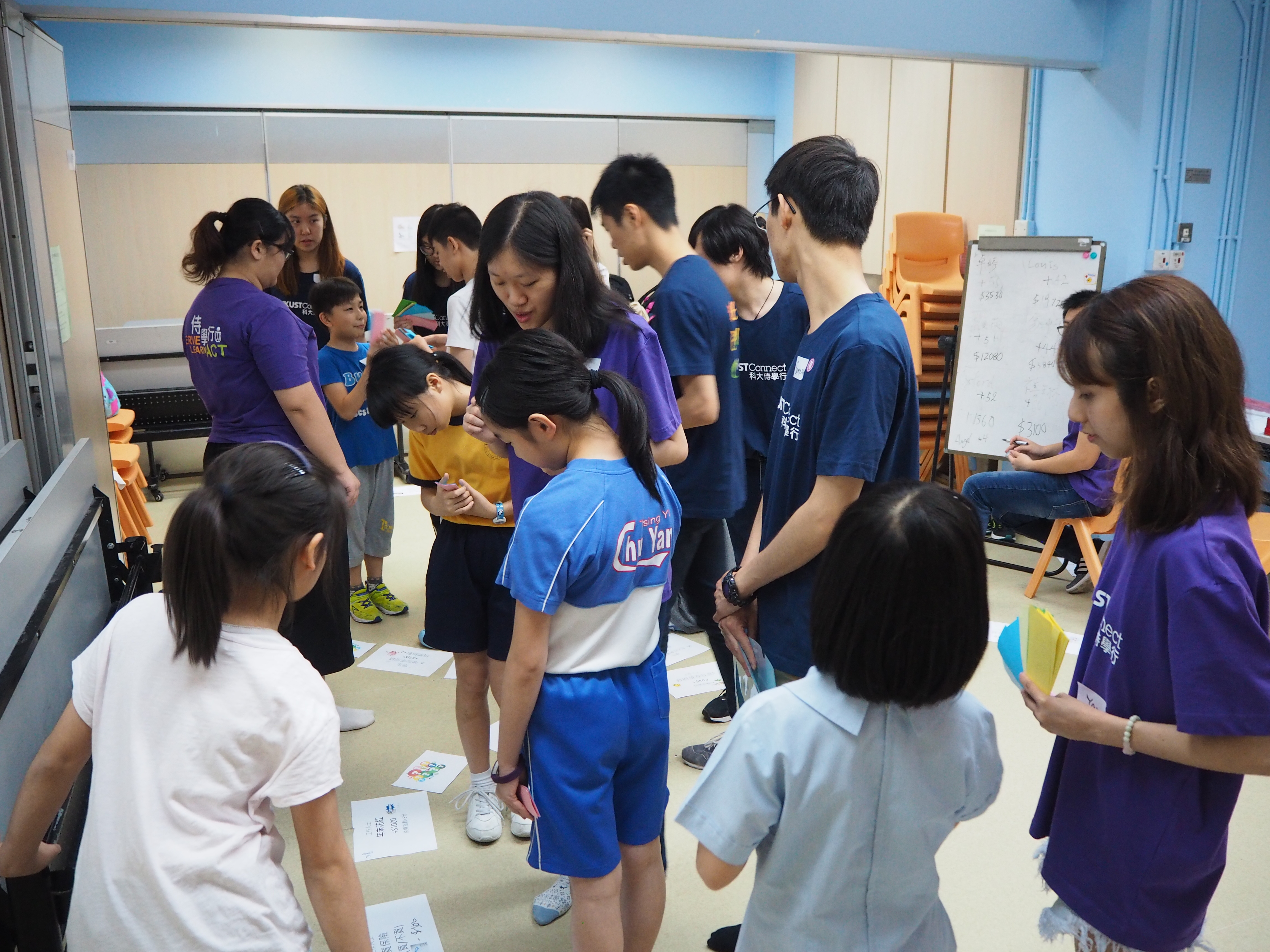 Students playing a game with volunteers