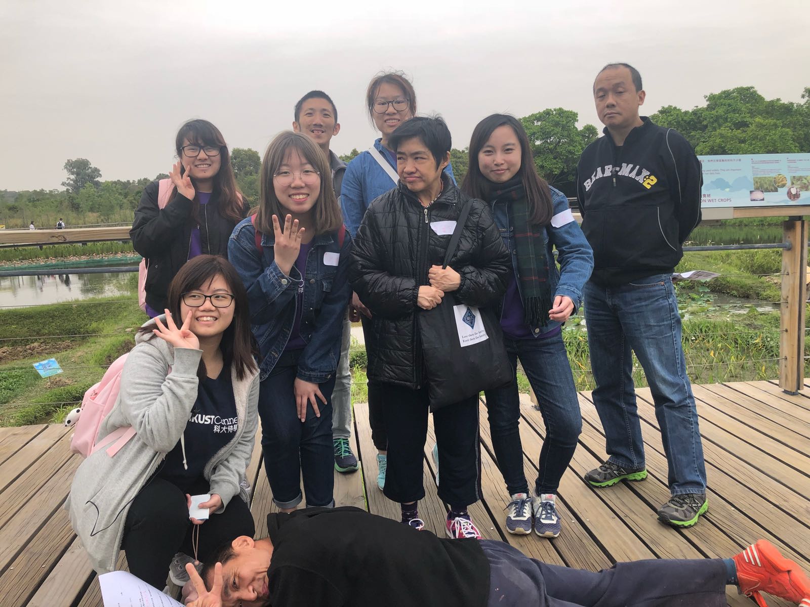 Volunteers take a photo with mentally challenged people.
