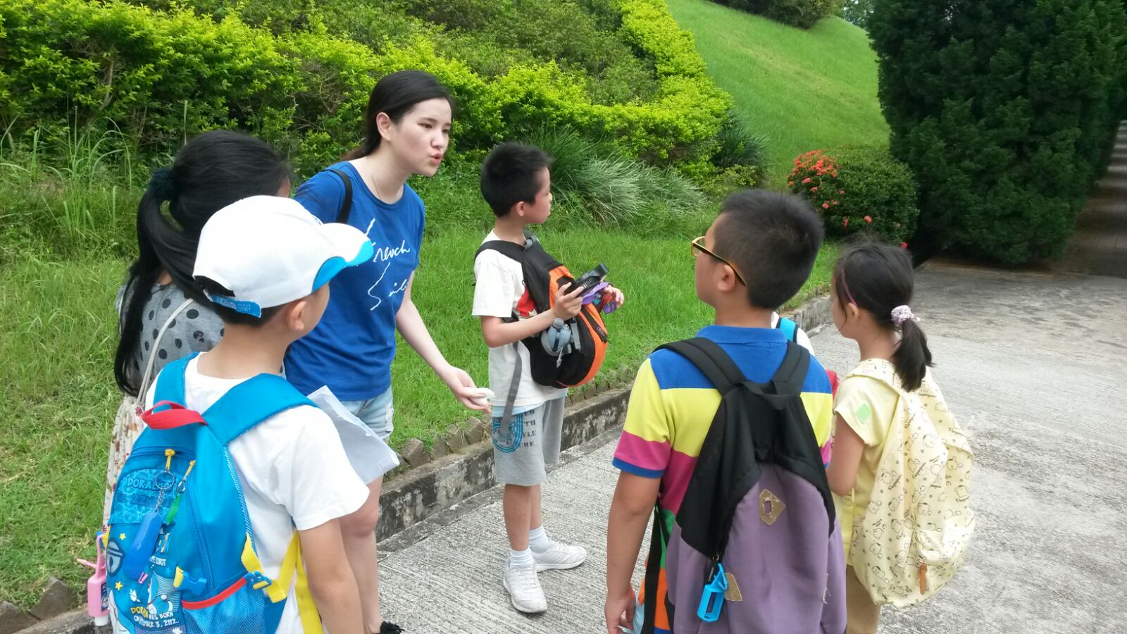 Our student volunteer giving instructions to children