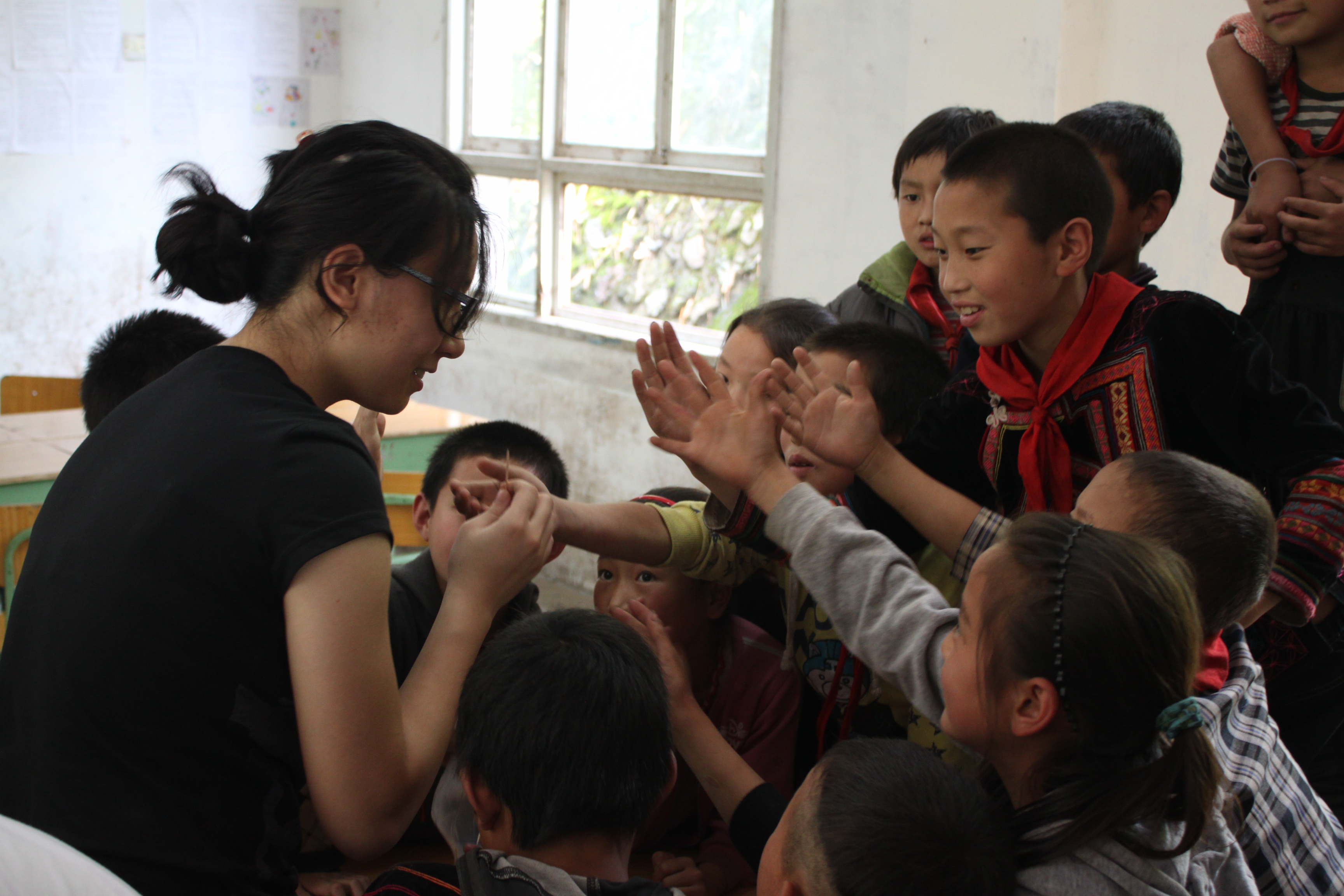 Kids are eager to try out a science experiment.